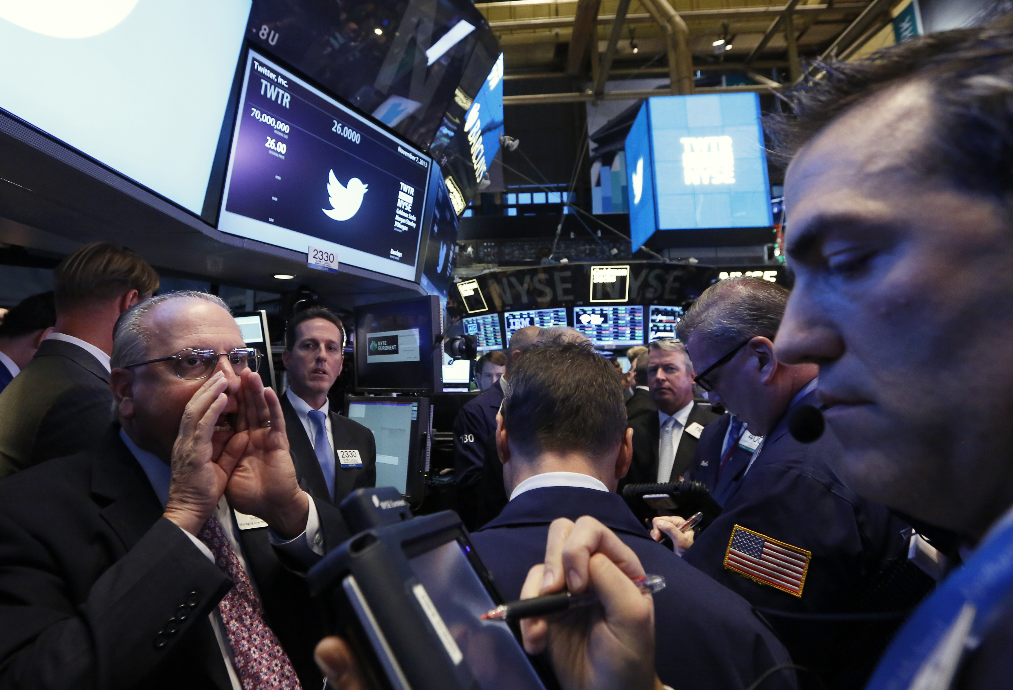 Traders get to work during Twitter Inc.'s IPO on the floor of the New York Stock Exchange in New York Nov. 7, 2013.
