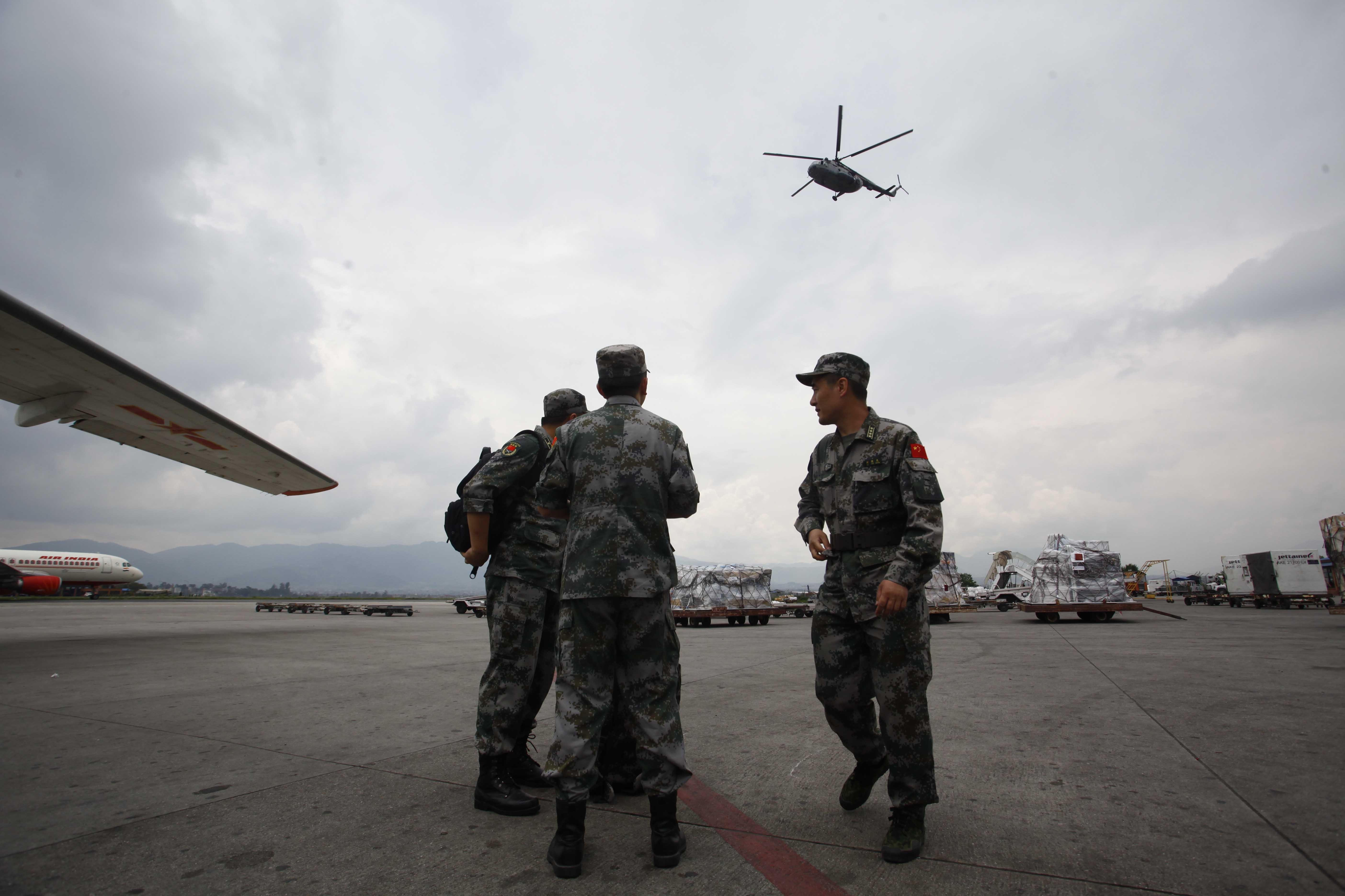 Members of Chinese People's Liberation Army Air Force arrive in Nepal to provide aid following Saturday's earthquake at Tribhuvan International Airport in Kathmandu, Nepal on April 28, 2015.