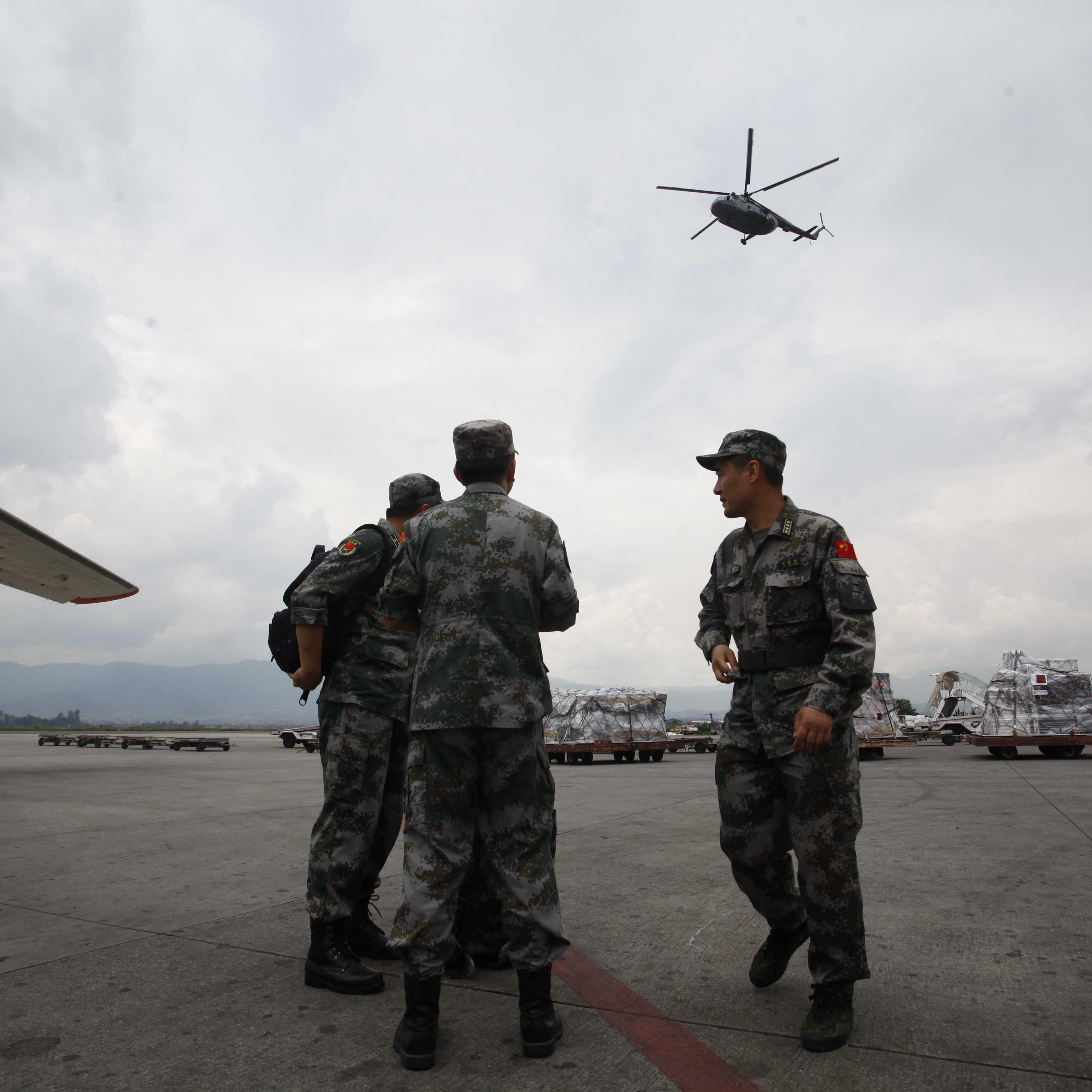 Members of Chinese People's Liberation Army Air Force arrive in Nepal to provide aid following Saturday's earthquake at Tribhuvan International Airport in Kathmandu, Nepal on April 28, 2015.
