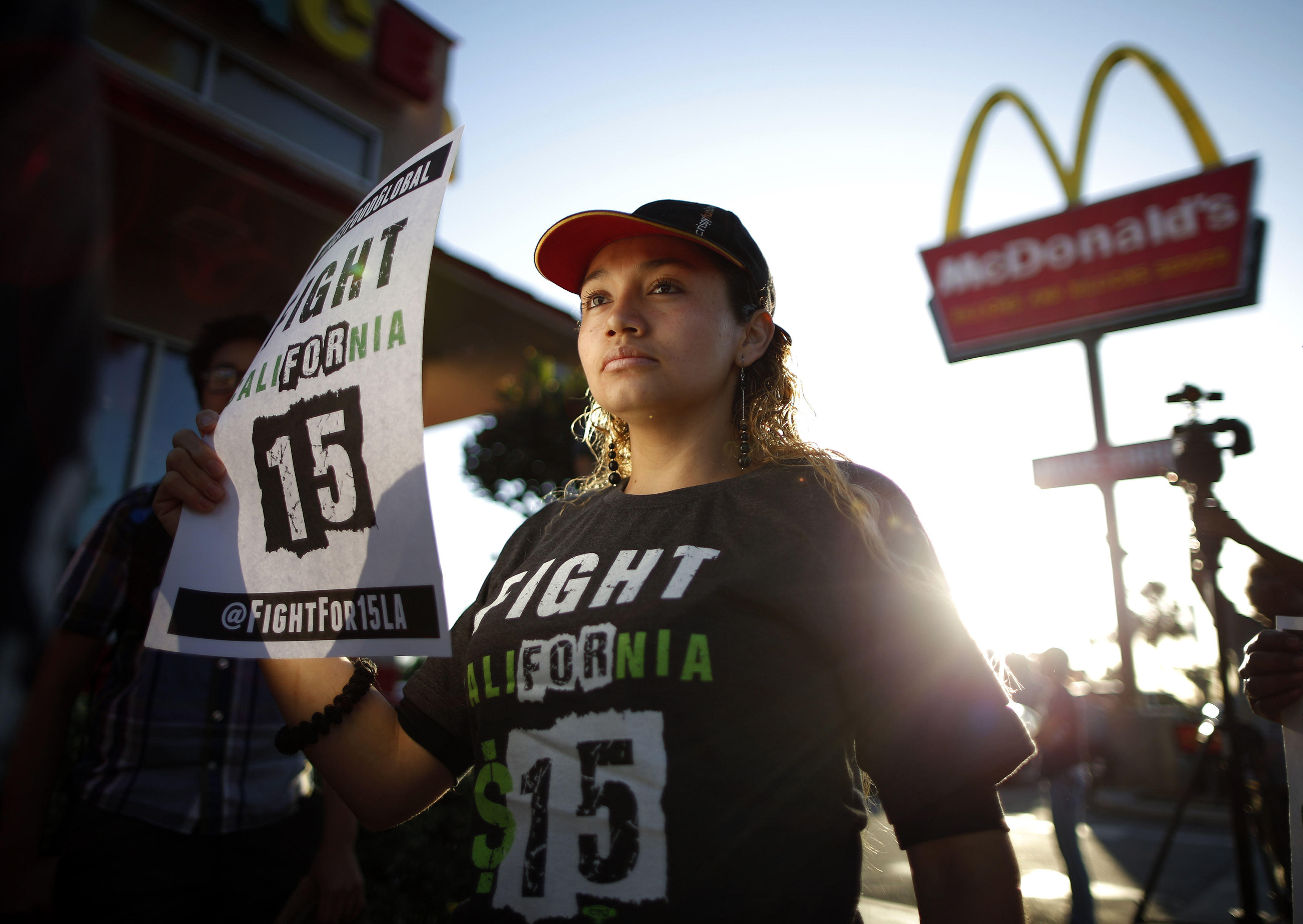 Demonstrators take part in a protest to demand higher wages for fast-food workers outside McDonald's in Los Angeles, on May 15, 2014.