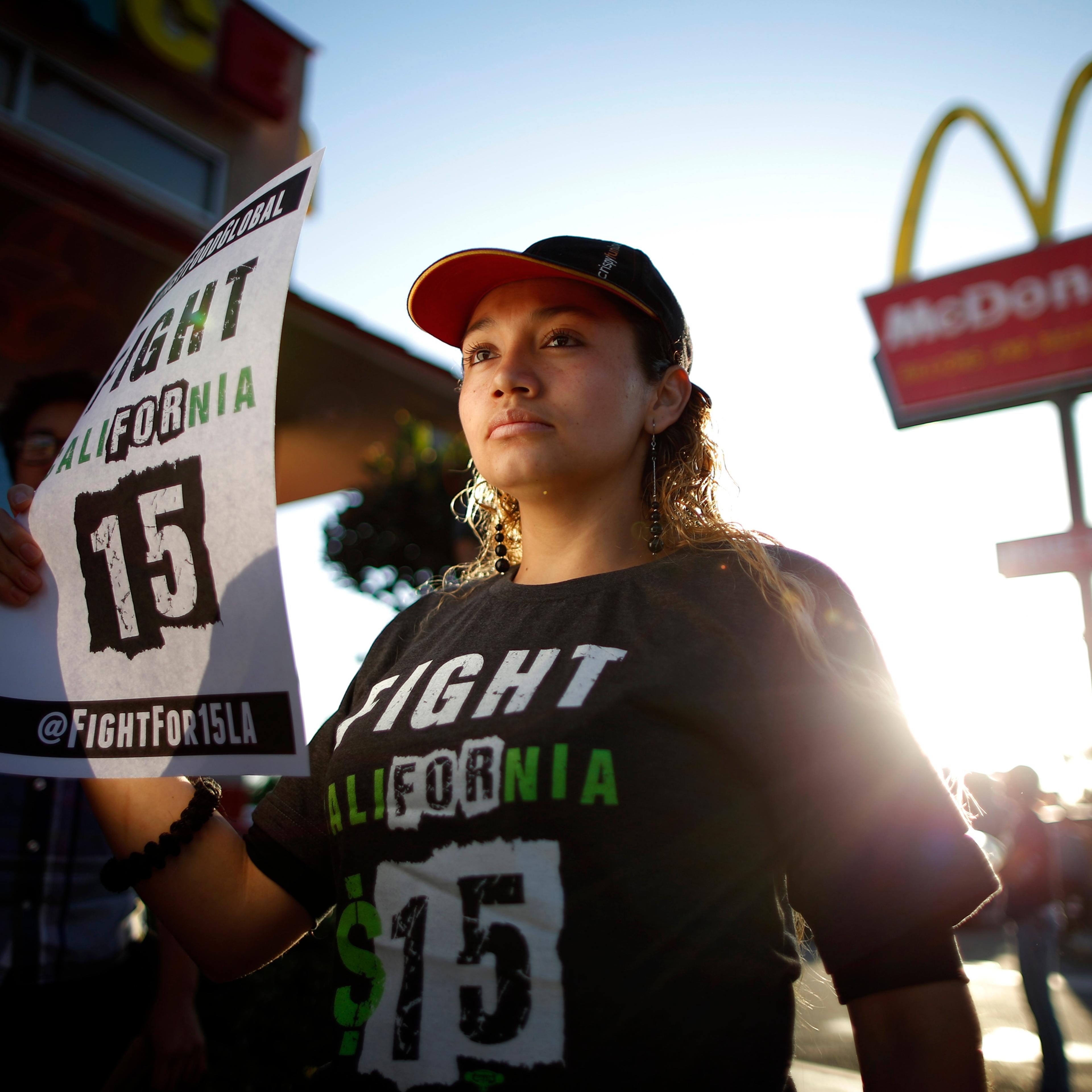 Demonstrators take part in a protest to demand higher wages for fast-food workers outside McDonald's in Los Angeles, on May 15, 2014.