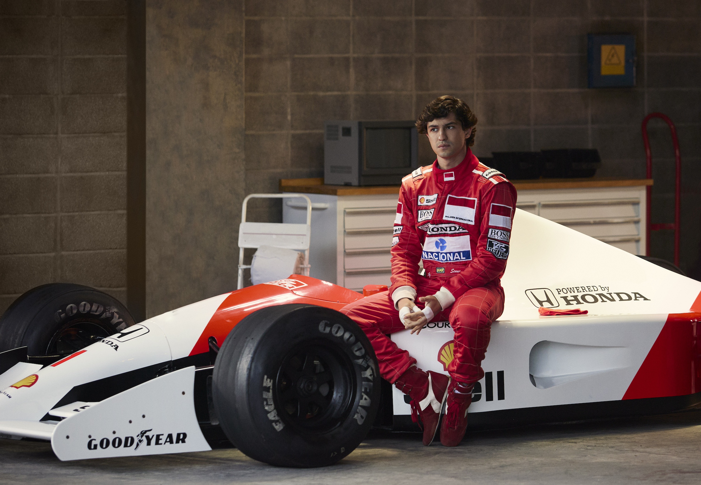 An Image from the Senna series depicting an actor sitting on a race car