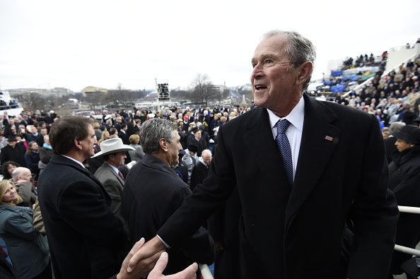 Former US President George W. Bush leaves after the Presidential Inauguration at the US Capitol on January 20, 2017 in Washington, DC.