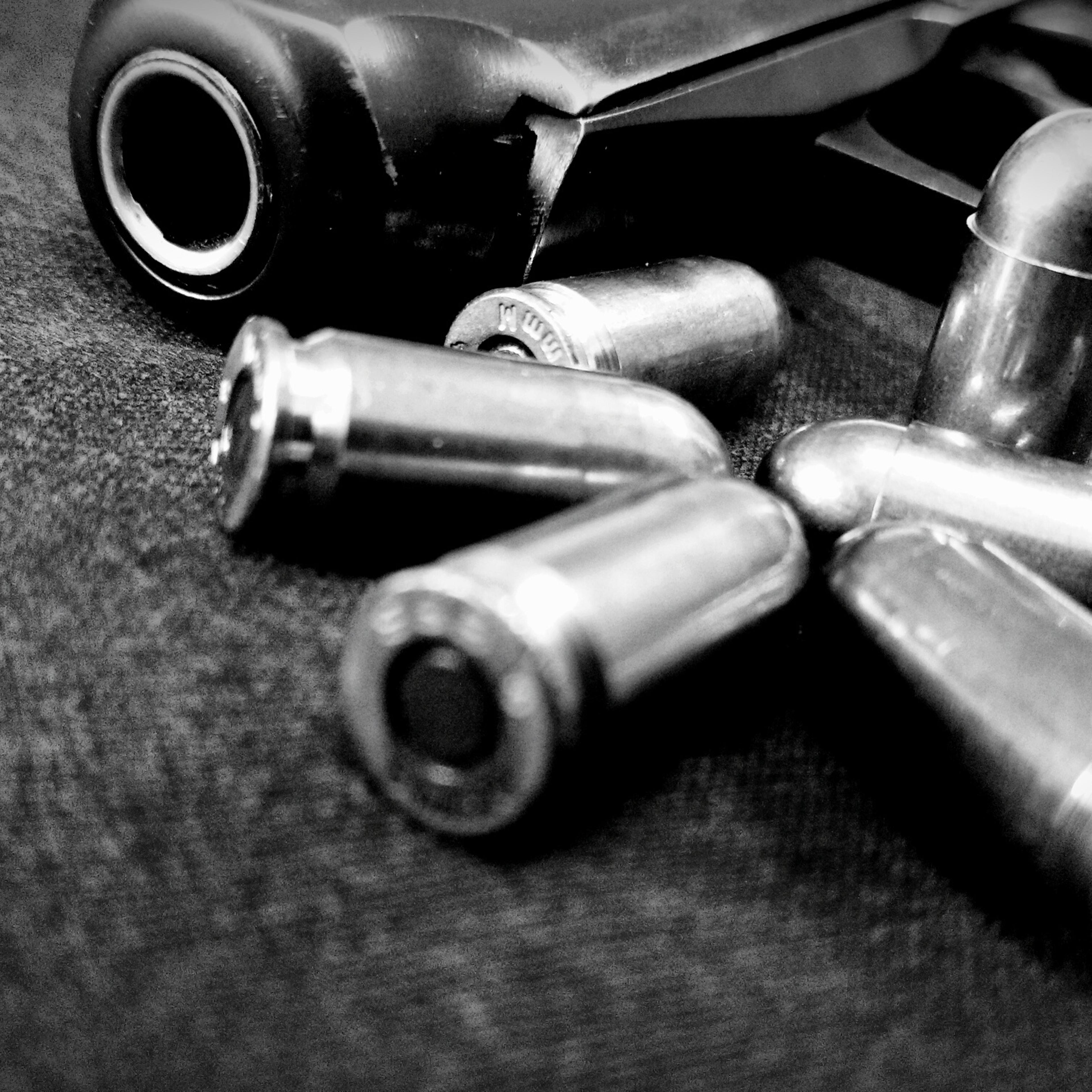 Close-Up Of Handgun And Bullets