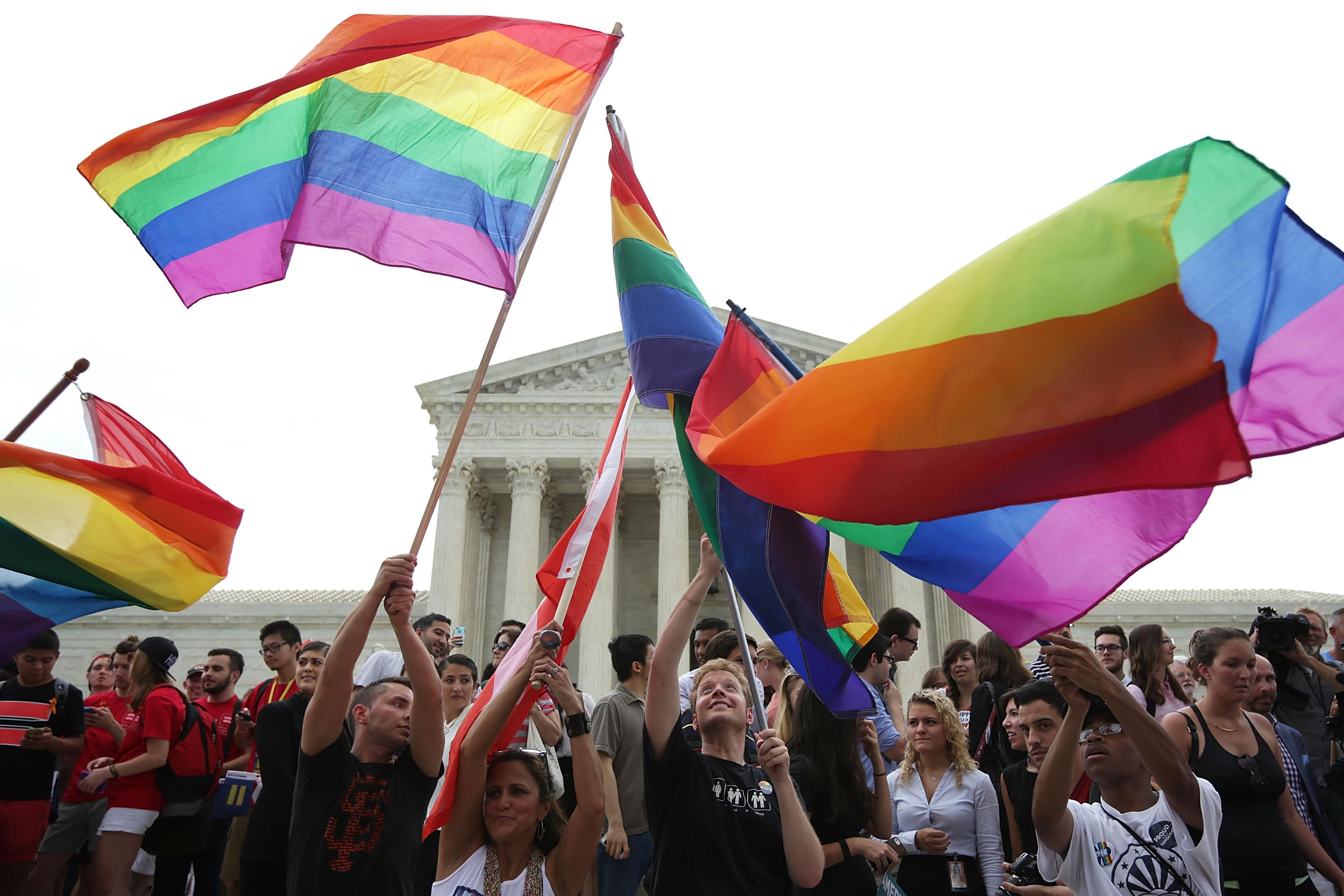 Same-sex marriage supporters rejoice after the U.S Supreme Court hands down a ruling regarding same-sex marriage June 26, 2015 outside the Supreme Court in Washington, DC.