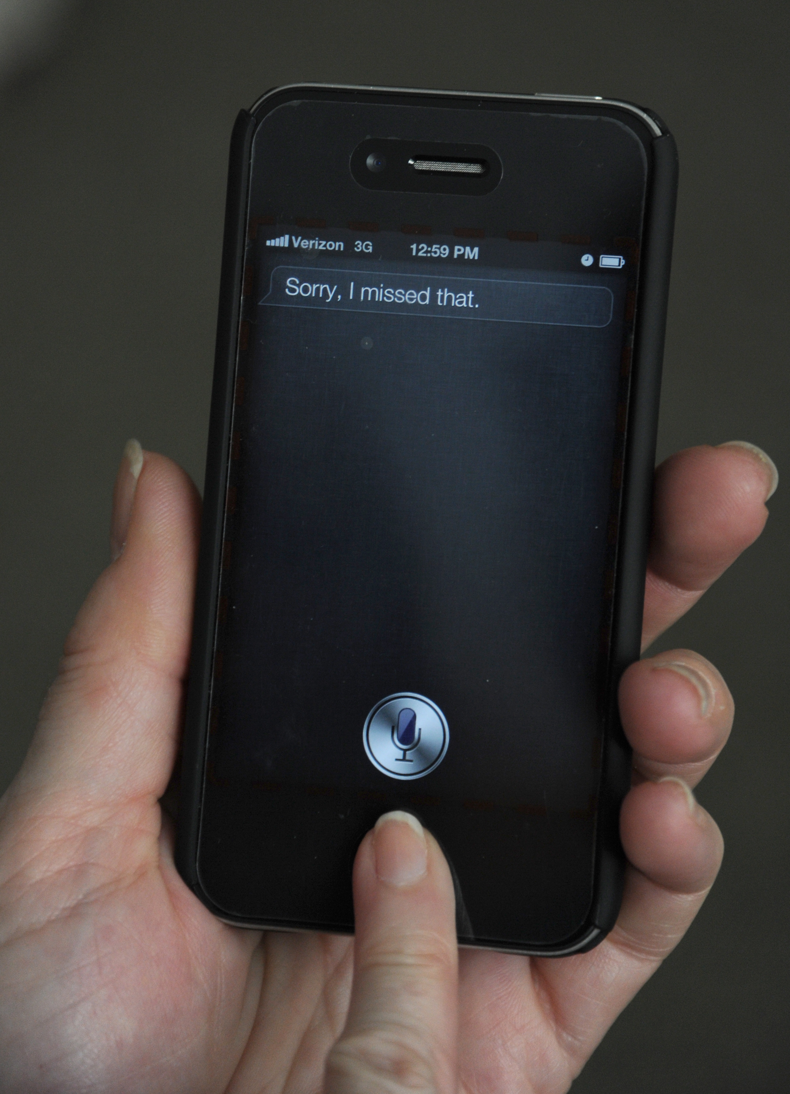 A woman tries to use "Siri" voice-activa