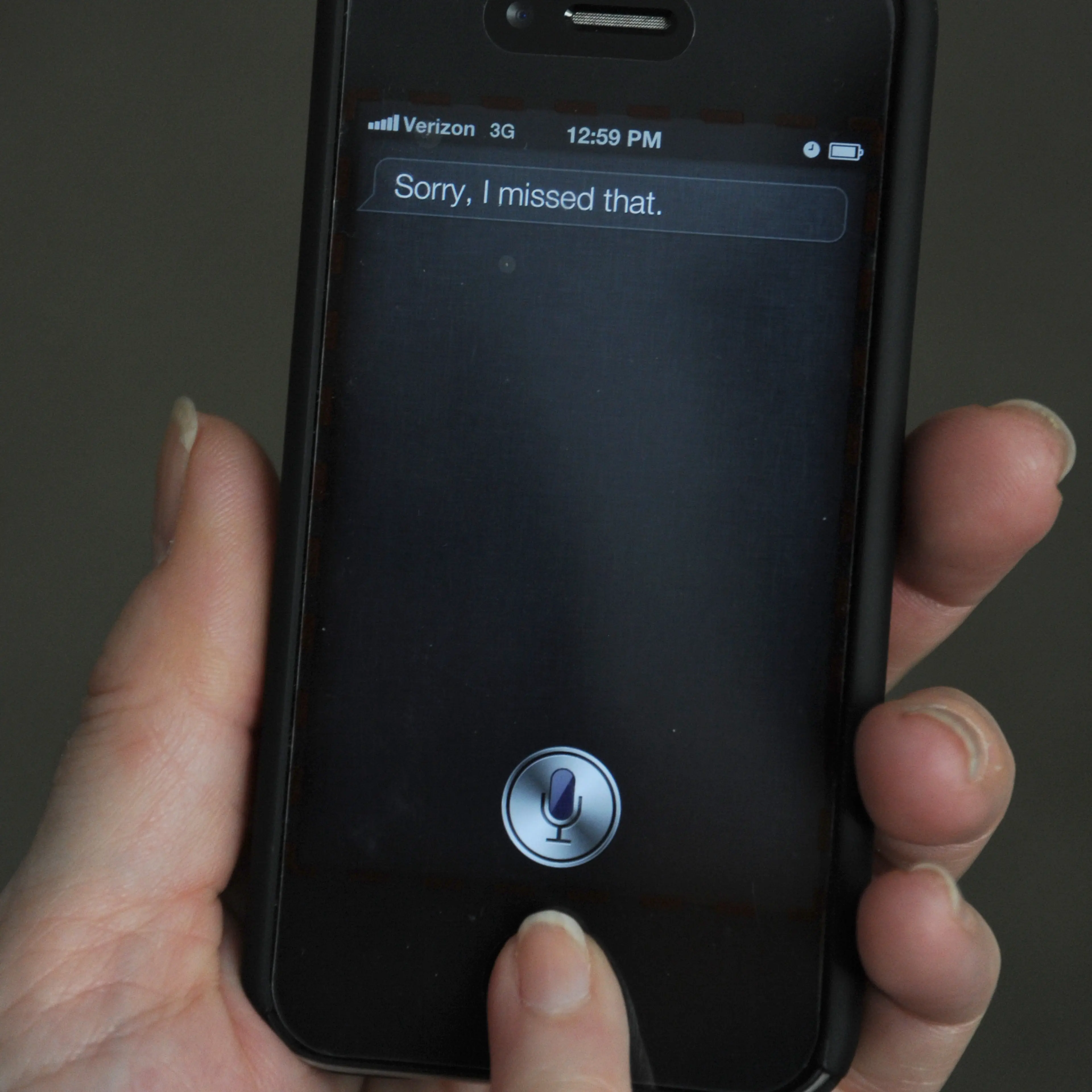 A woman tries to use "Siri" voice-activa