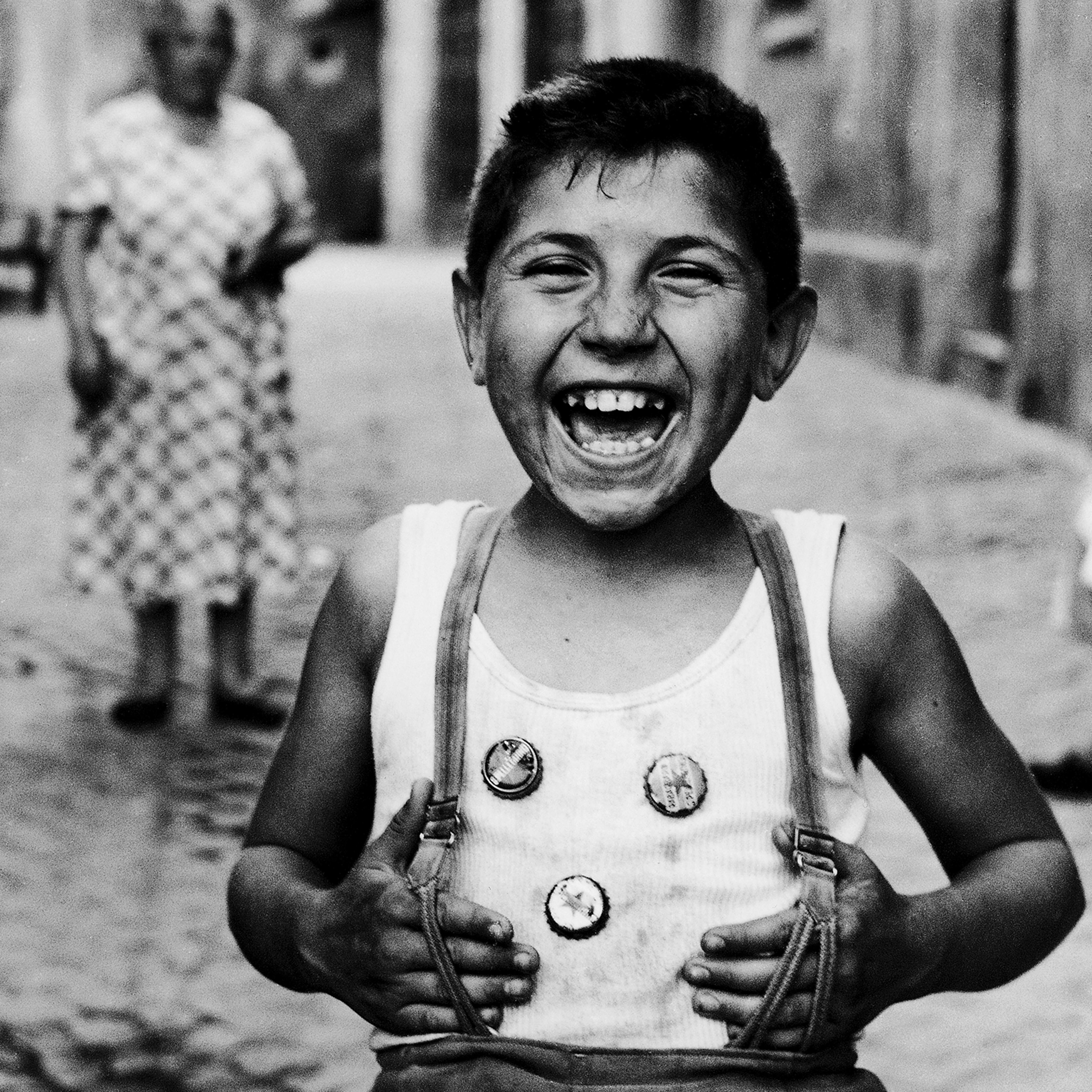 Laughing boy on street in Trastevere, Rome, 1958.