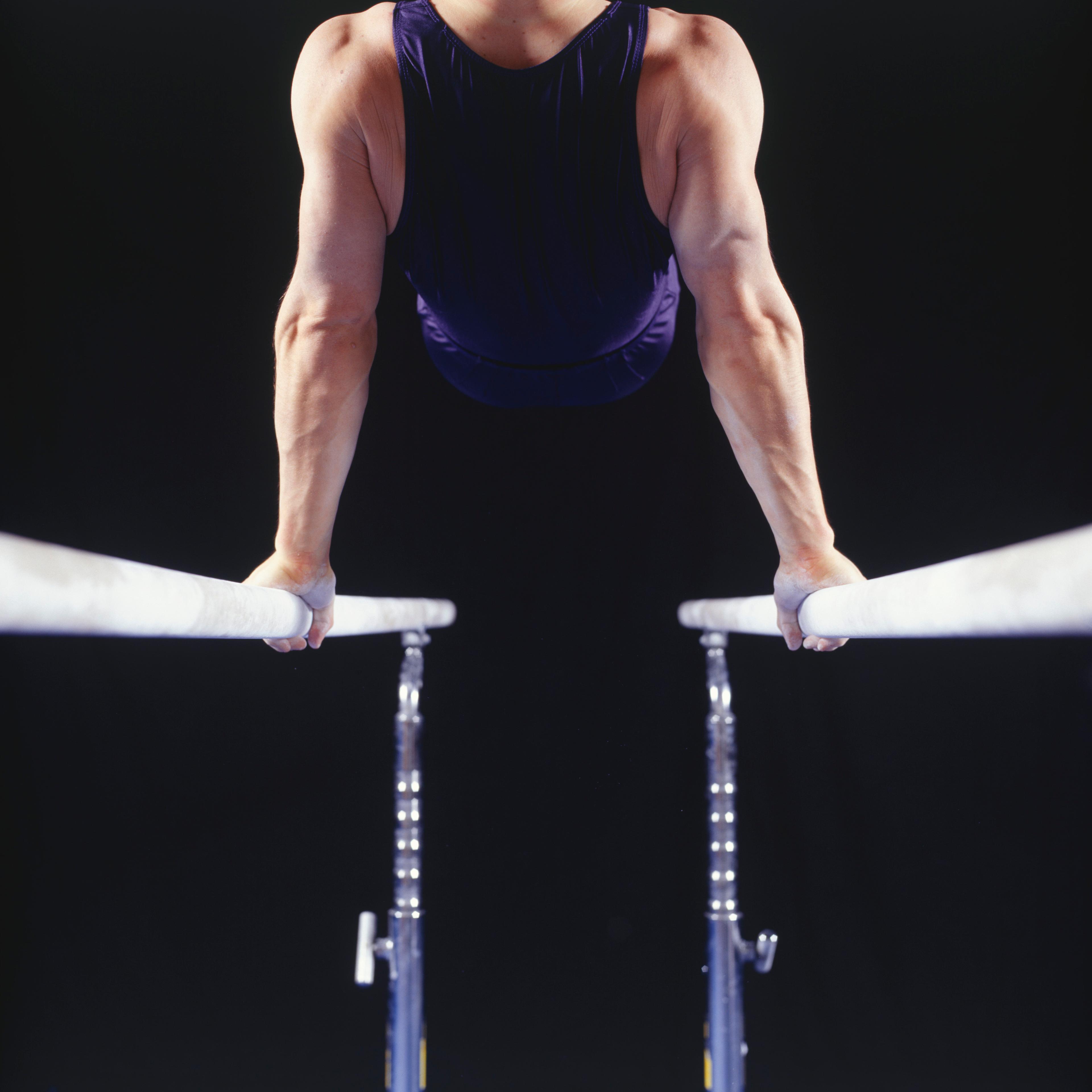 male-gymnast-parallel-bars