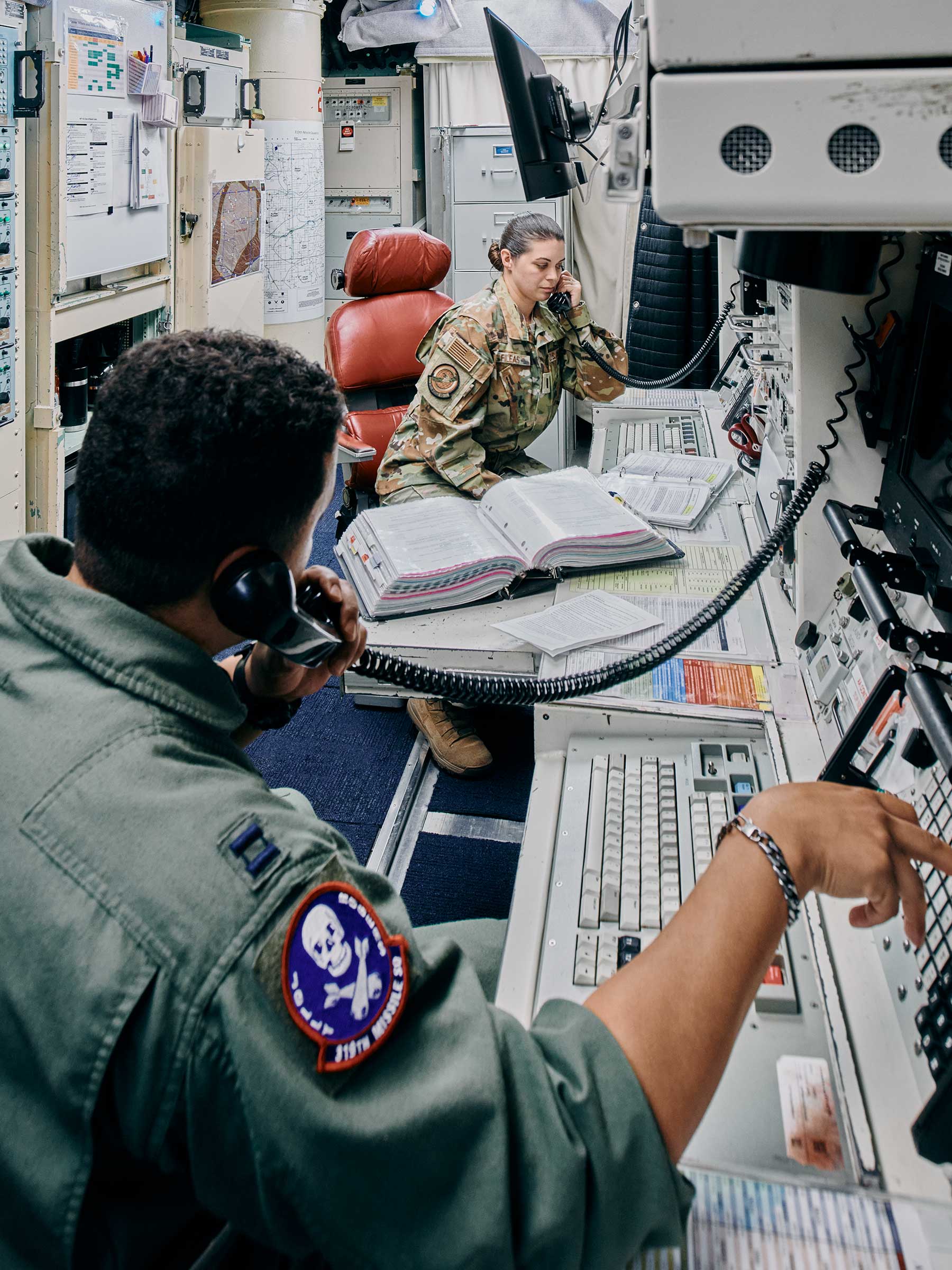 Moffett, front, and Fileas during a 24-hour shift with 10 nuclear missiles in an underground command center in Wyoming.