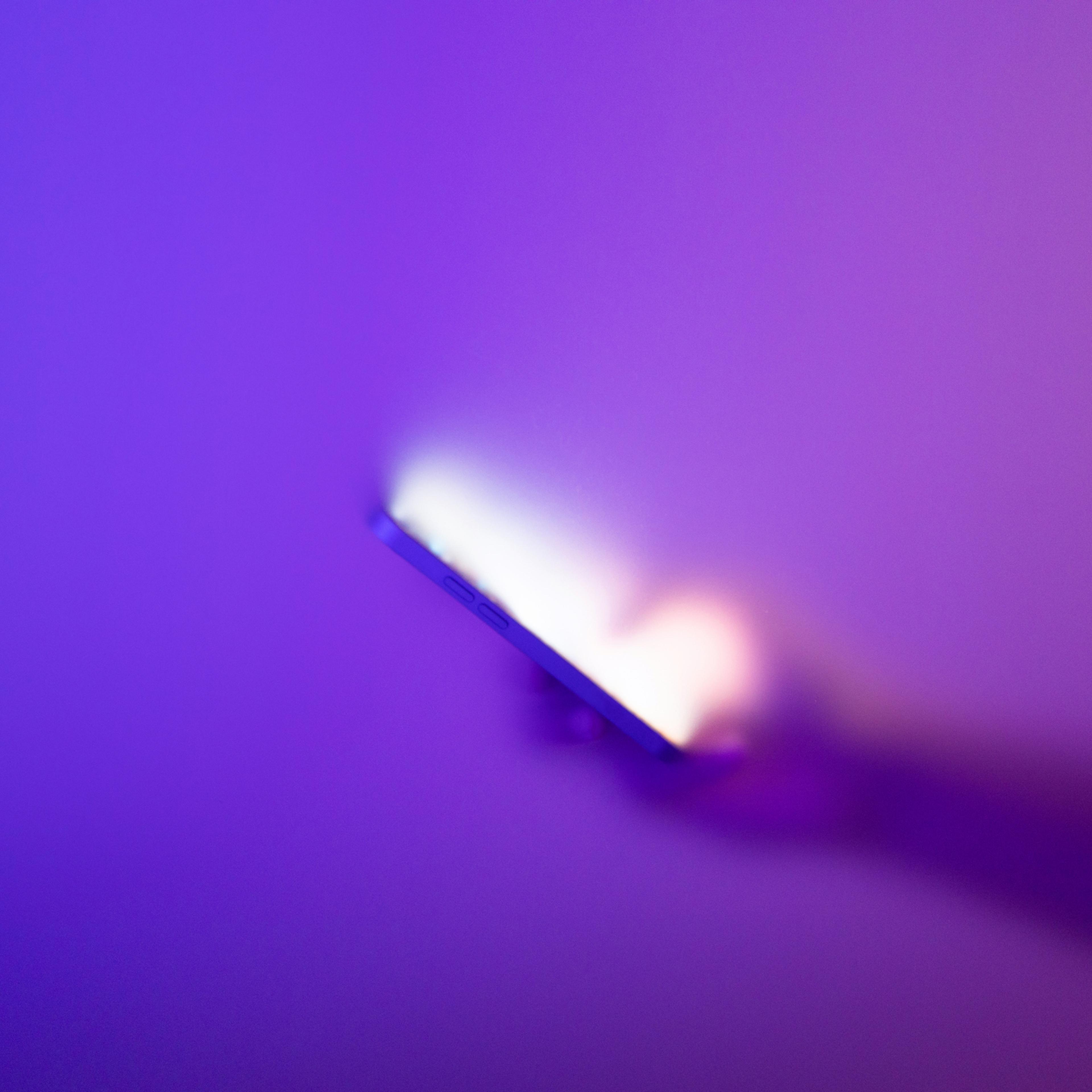Close-up of using smartphone on frosted glass background