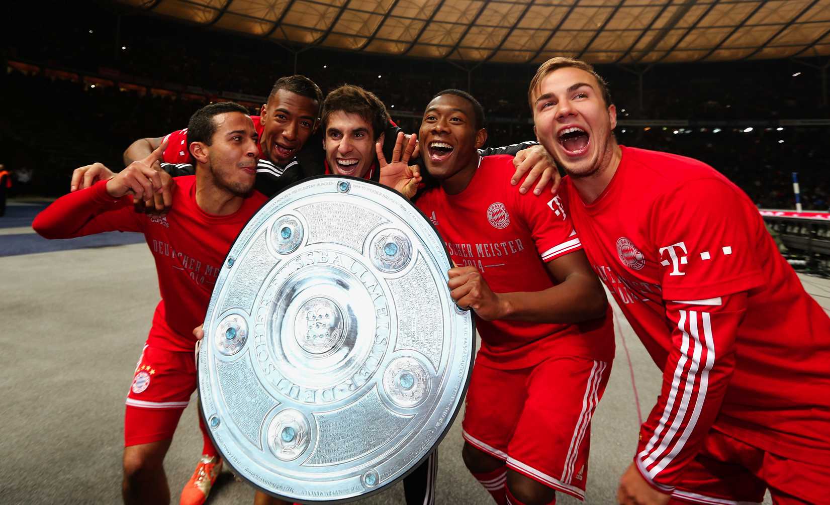 Thiago Alcantara, Jerome Boateng, Javier Martínez Aguinaga, David Alaba and Mario Goetze of Bayern Muenchen celebrate winning the German Championship after the Bundesliga match between Hertha BSC and FC Bayern Muenchen at Olympiastadion on March 25, 2014 in Berlin, Germany.