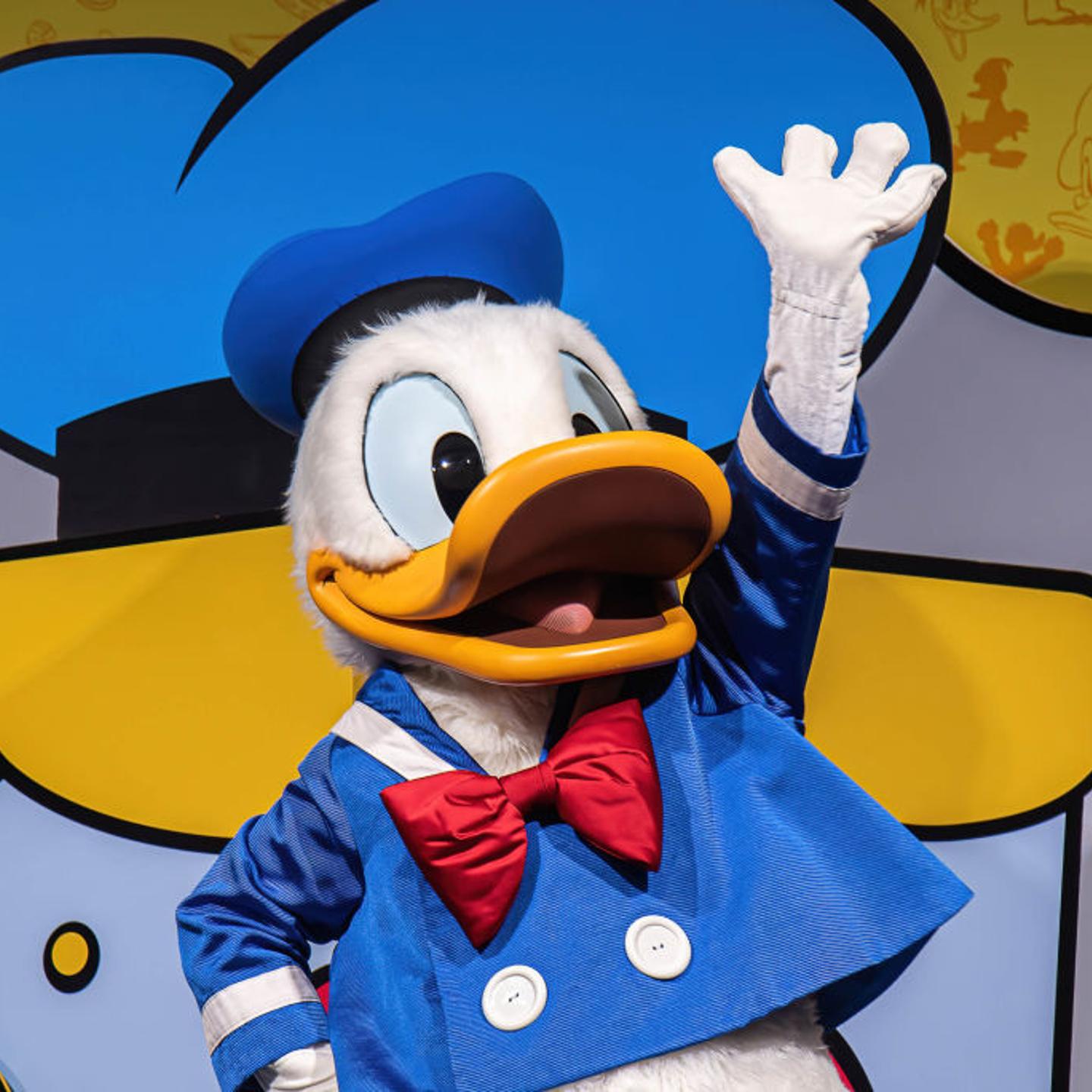 A Donald Duck mascot seen gesturing during the 90th