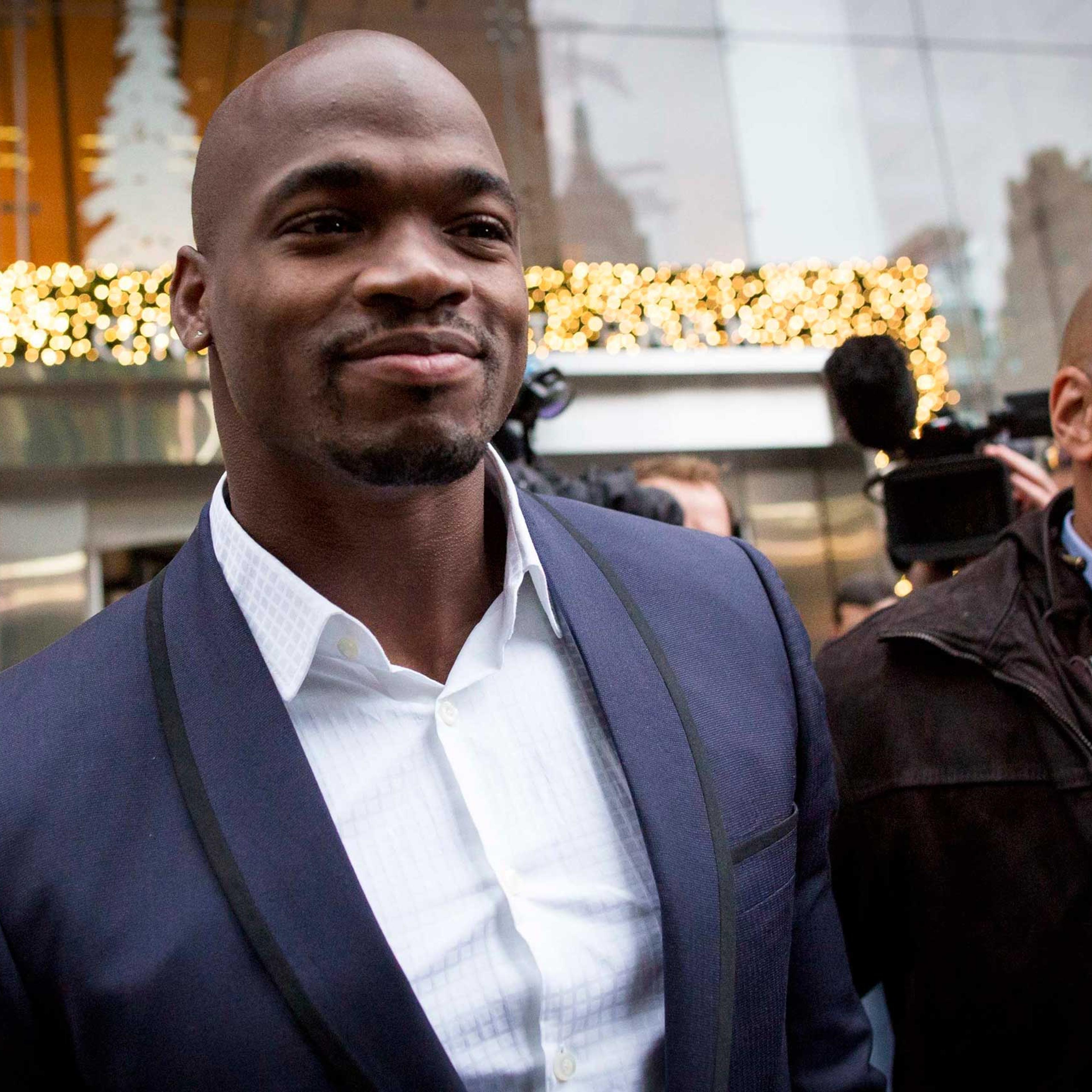 Suspended Minnesota Vikings running back Peterson exits following his hearing against the NFL over his punishment for child abuse, in New York