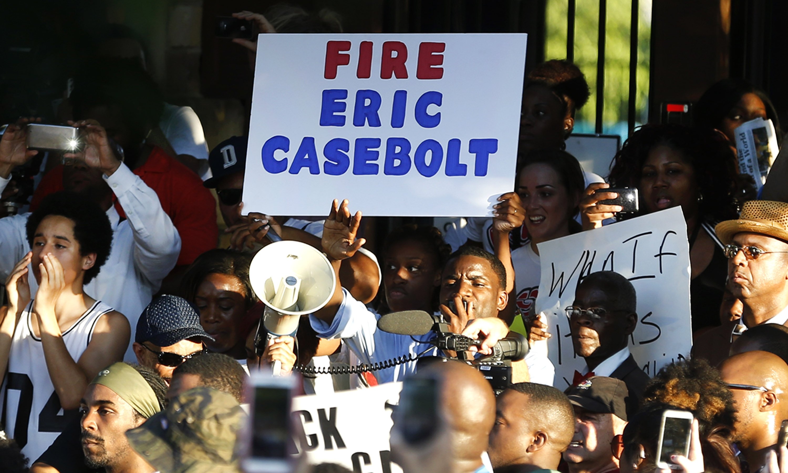 Demonstrators gather near a community pool on June 8, 2015, during a protest in response to an incident at the pool involving McKinney police officers in McKinney, Texas.