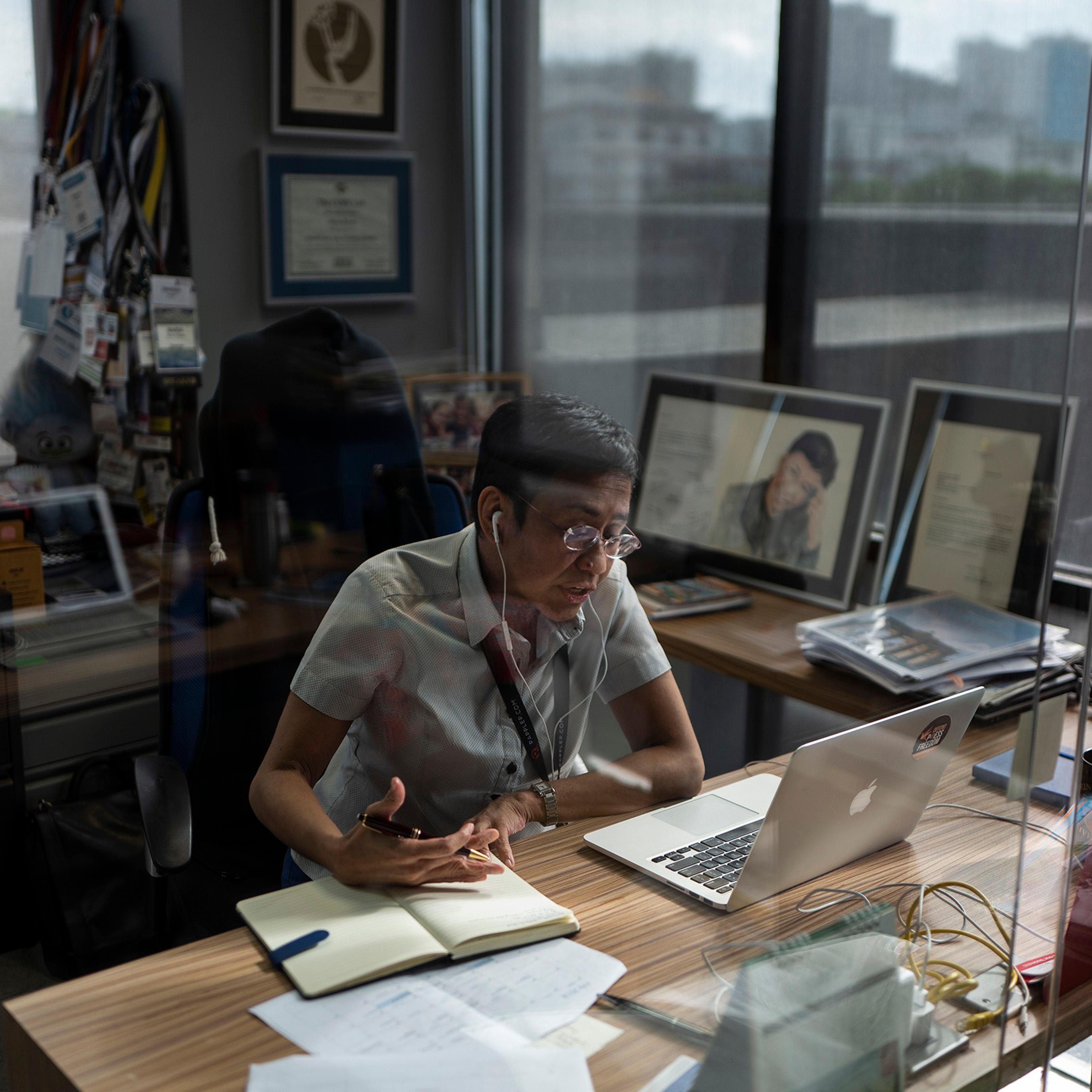 The writer in her office at Rappler in Manila