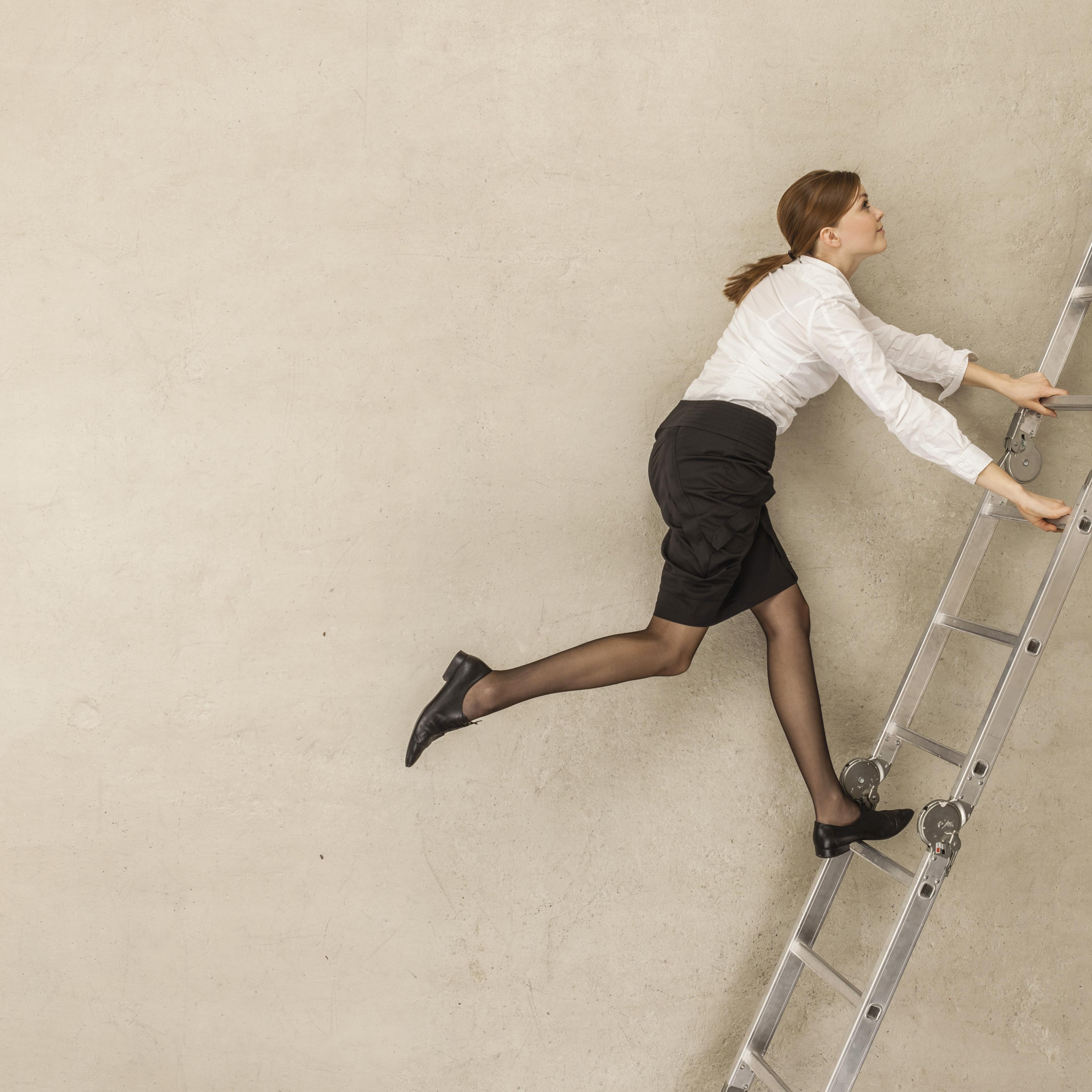 businesswoman-climbing-up-ladder