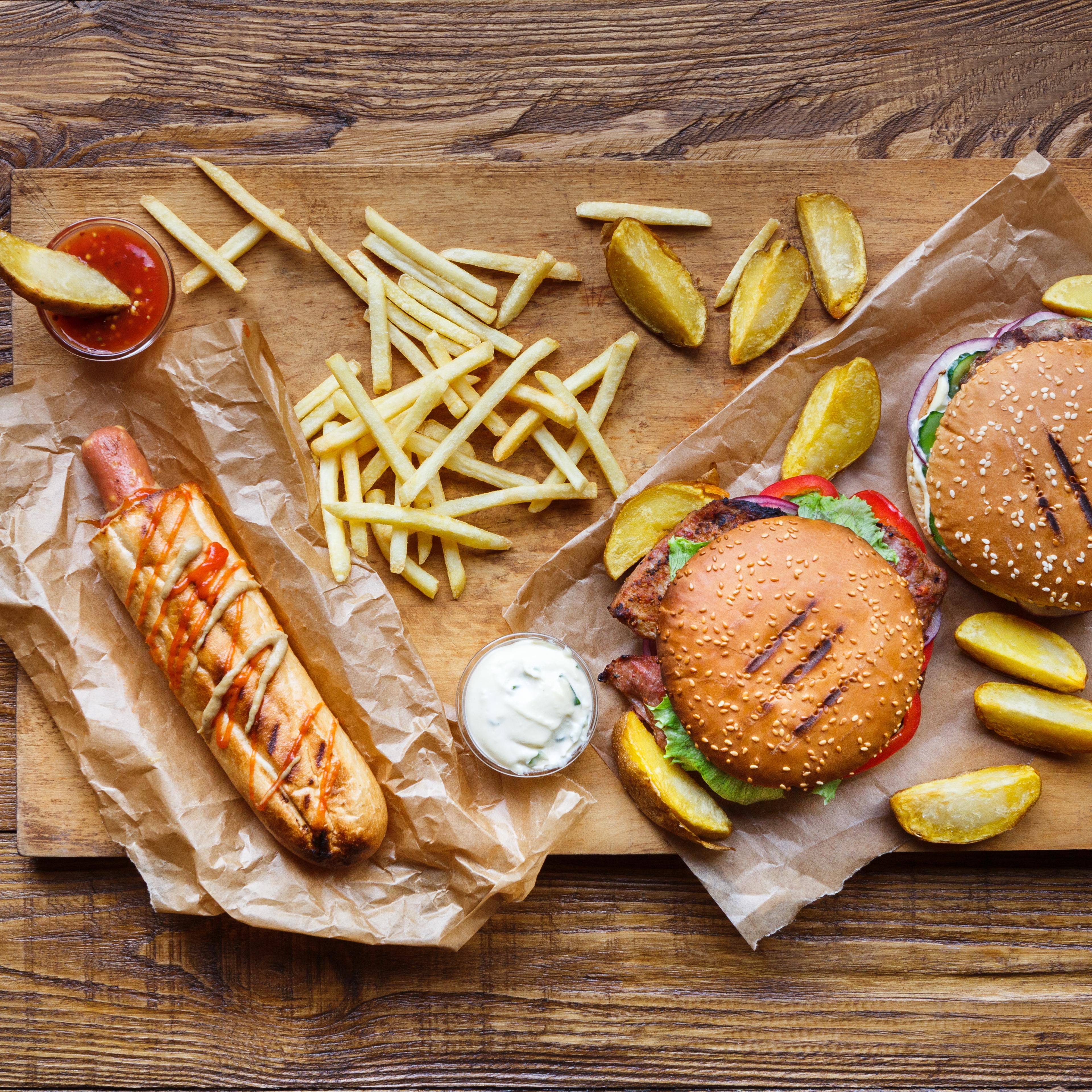 Fast food take away top view. Hamburger, hotdog and fries
