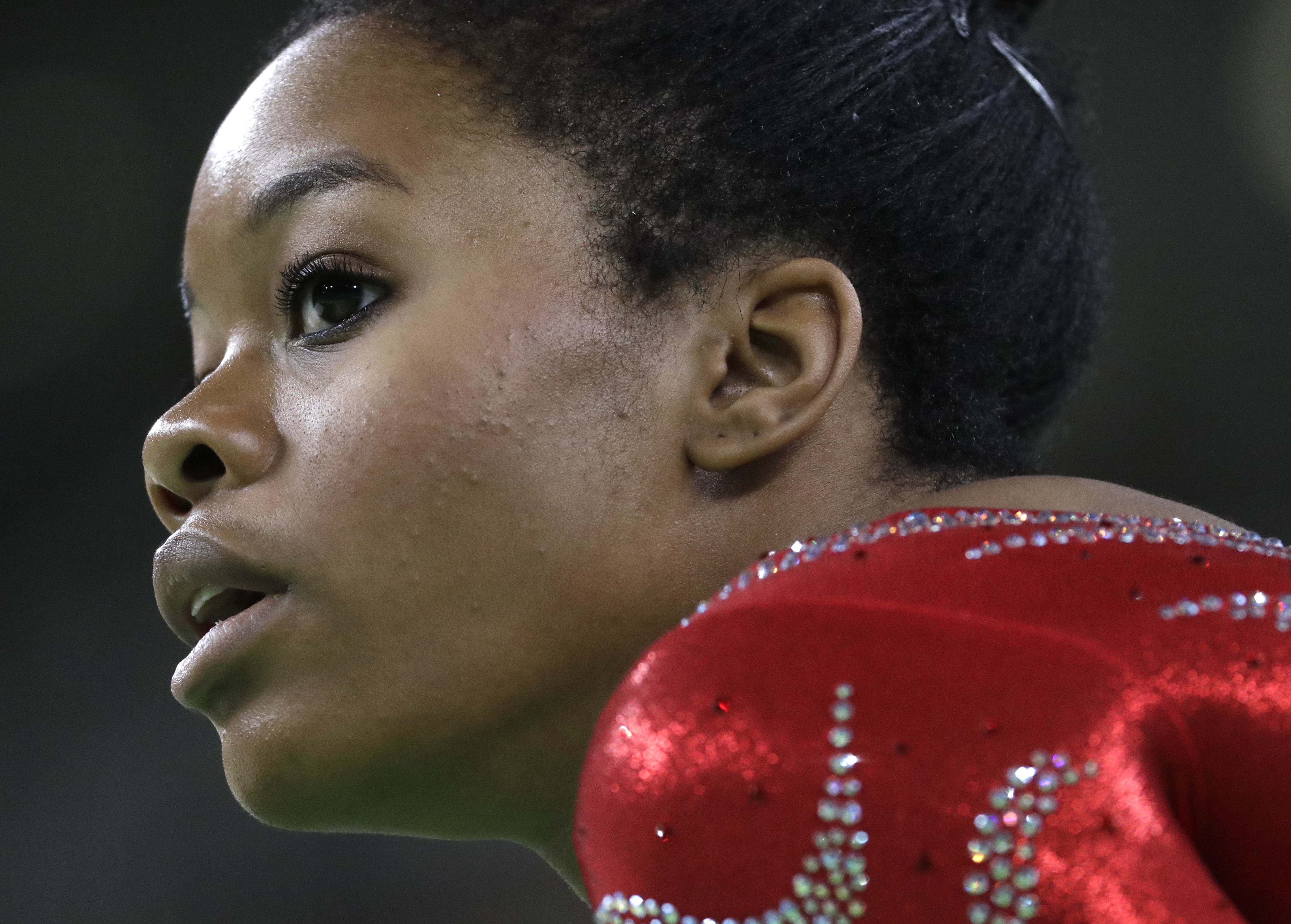 Gabrielle Douglas rests after her floor routine during the artistic gymnastics women's qualification at the 2016 Summer Olympics in Rio de Janeiro on Aug. 7, 2016.