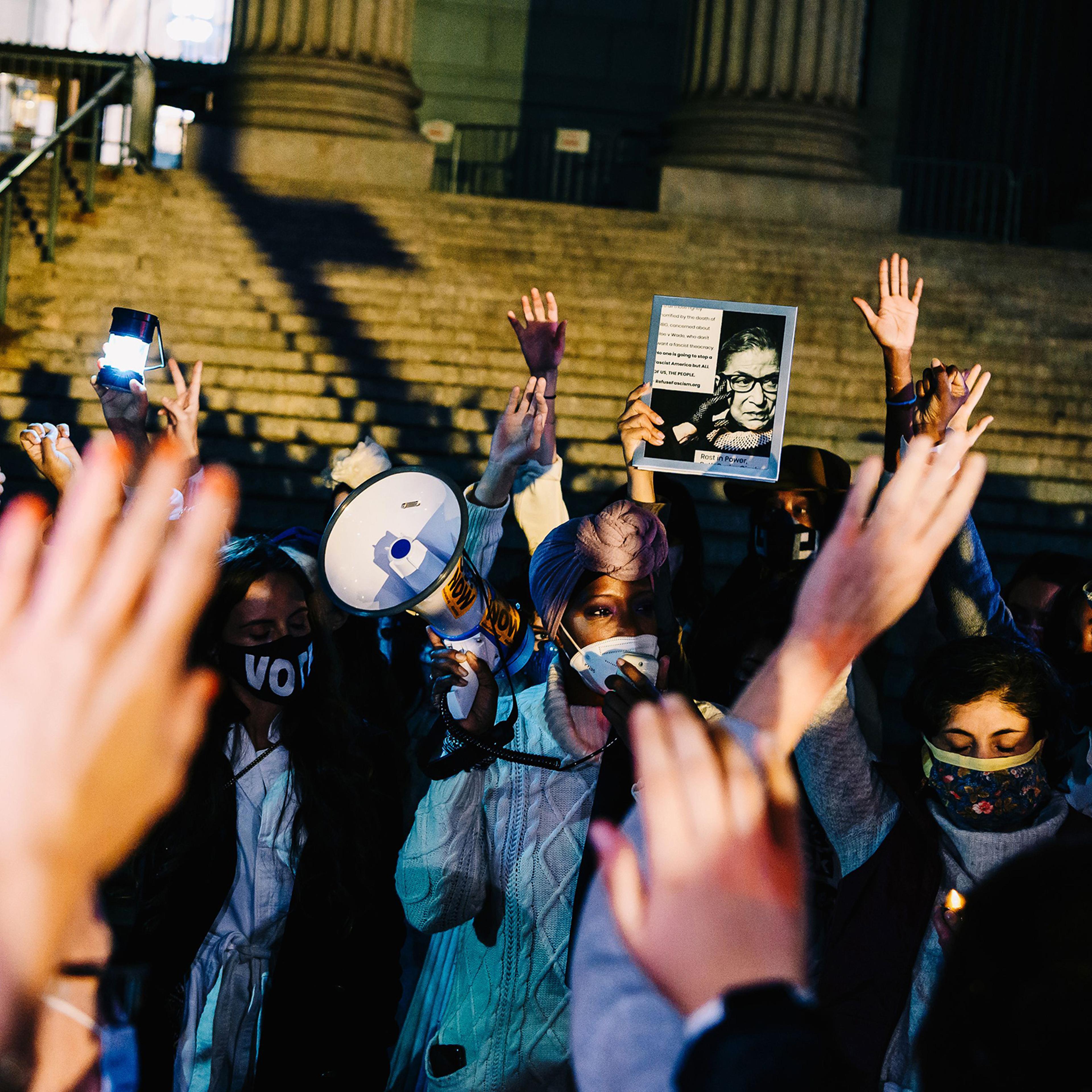 Mourners gather for a candlelight vigil to pay their respects to Supreme Court Justice Ruth Bader Ginsburg, who died a day earlier, at a Manhattan courthouse on Sept. 19, 2020.