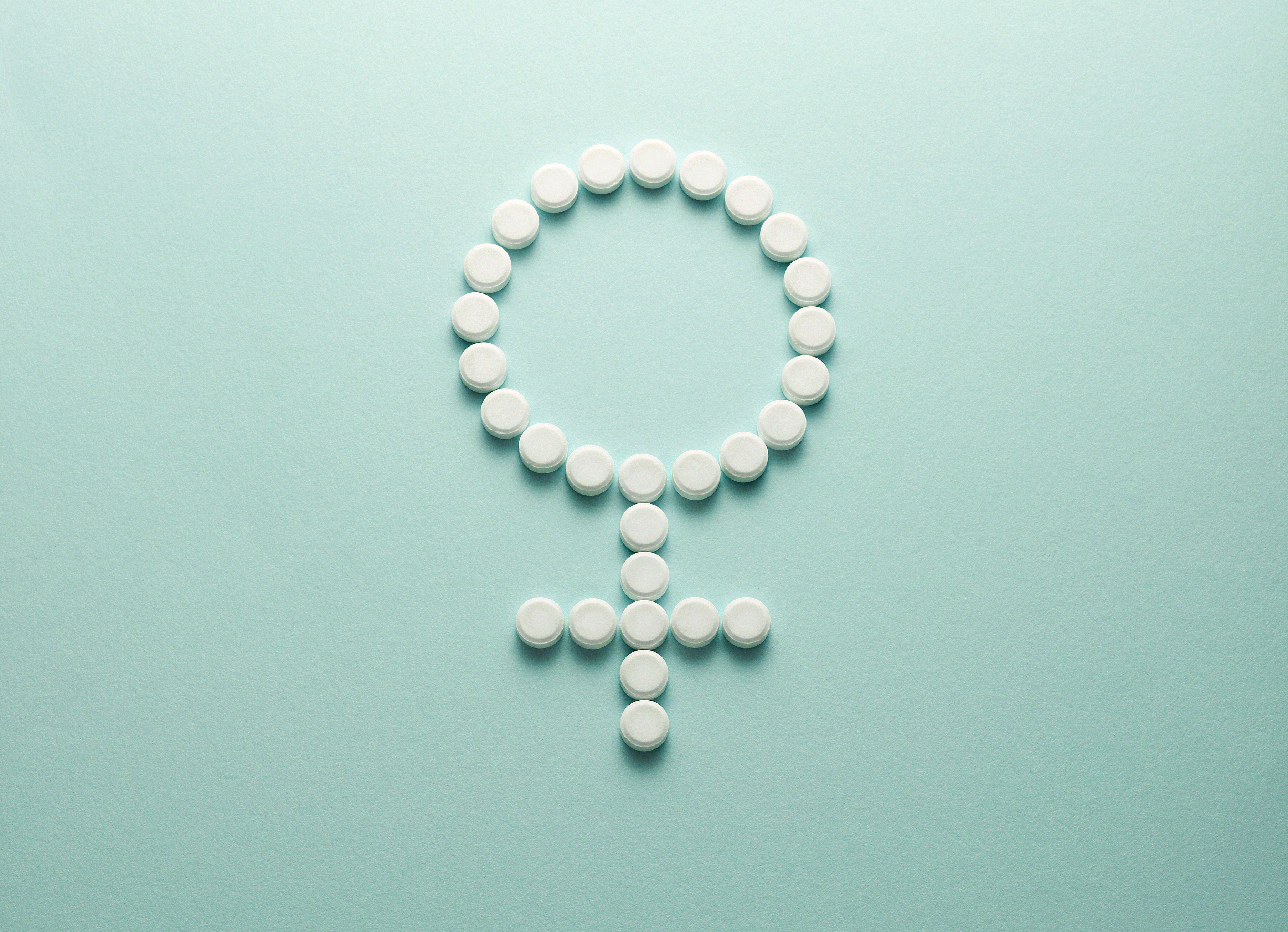 Female symbol made up of contraceptive pills
