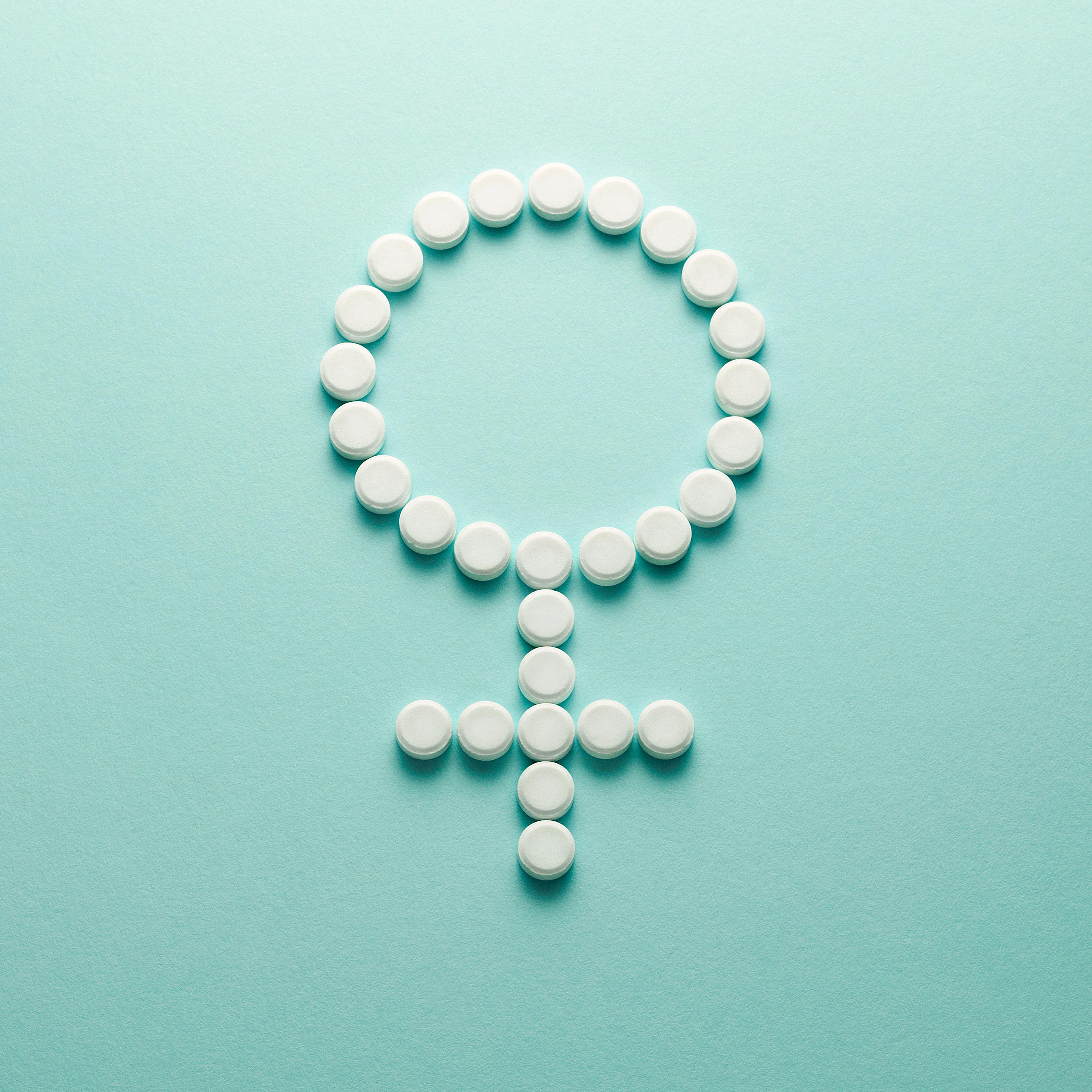 Female symbol made up of contraceptive pills