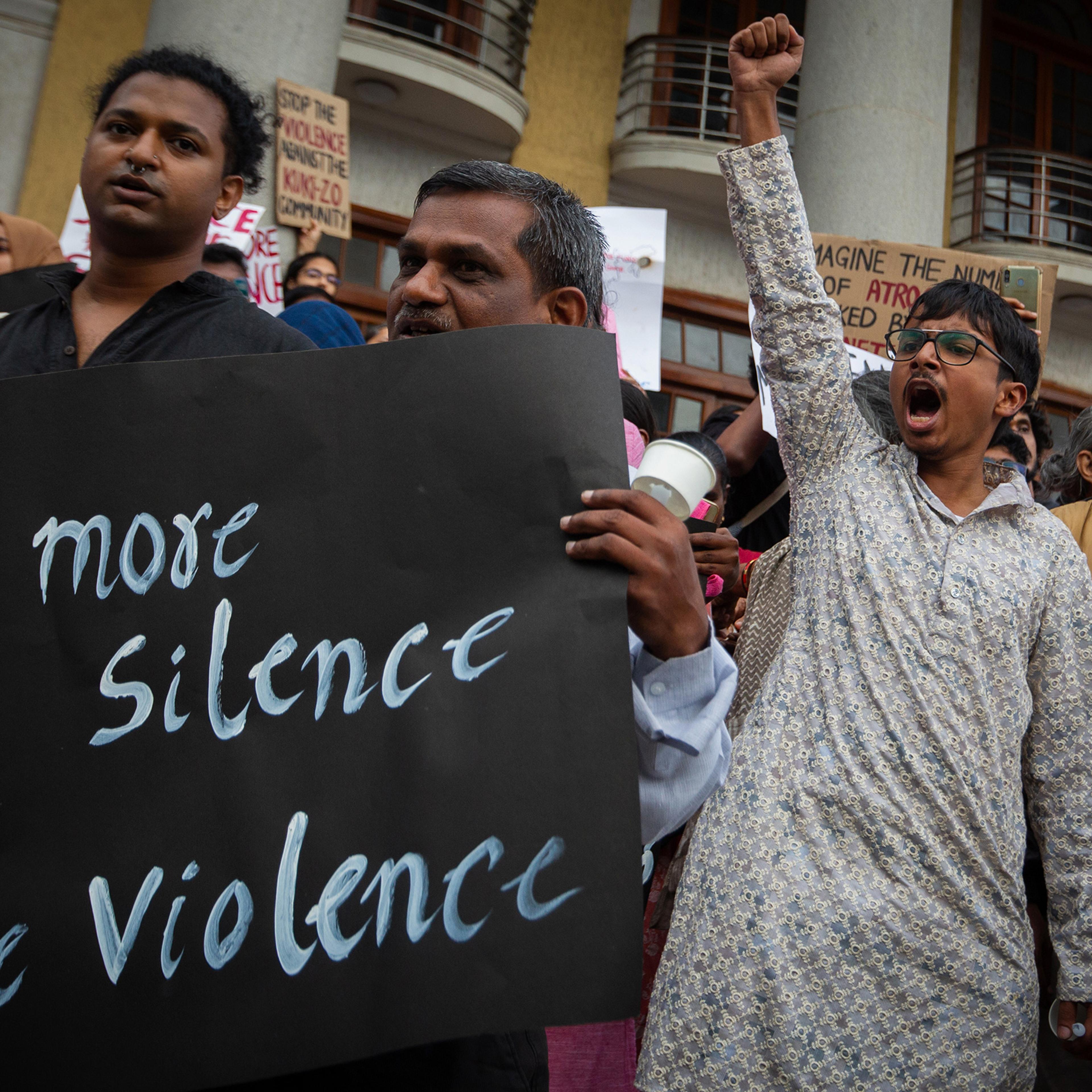 People shout slogans and hold up placards during a protest against violence in the northeastern Indian state of Manipur on July 21 in Bengaluru, India.