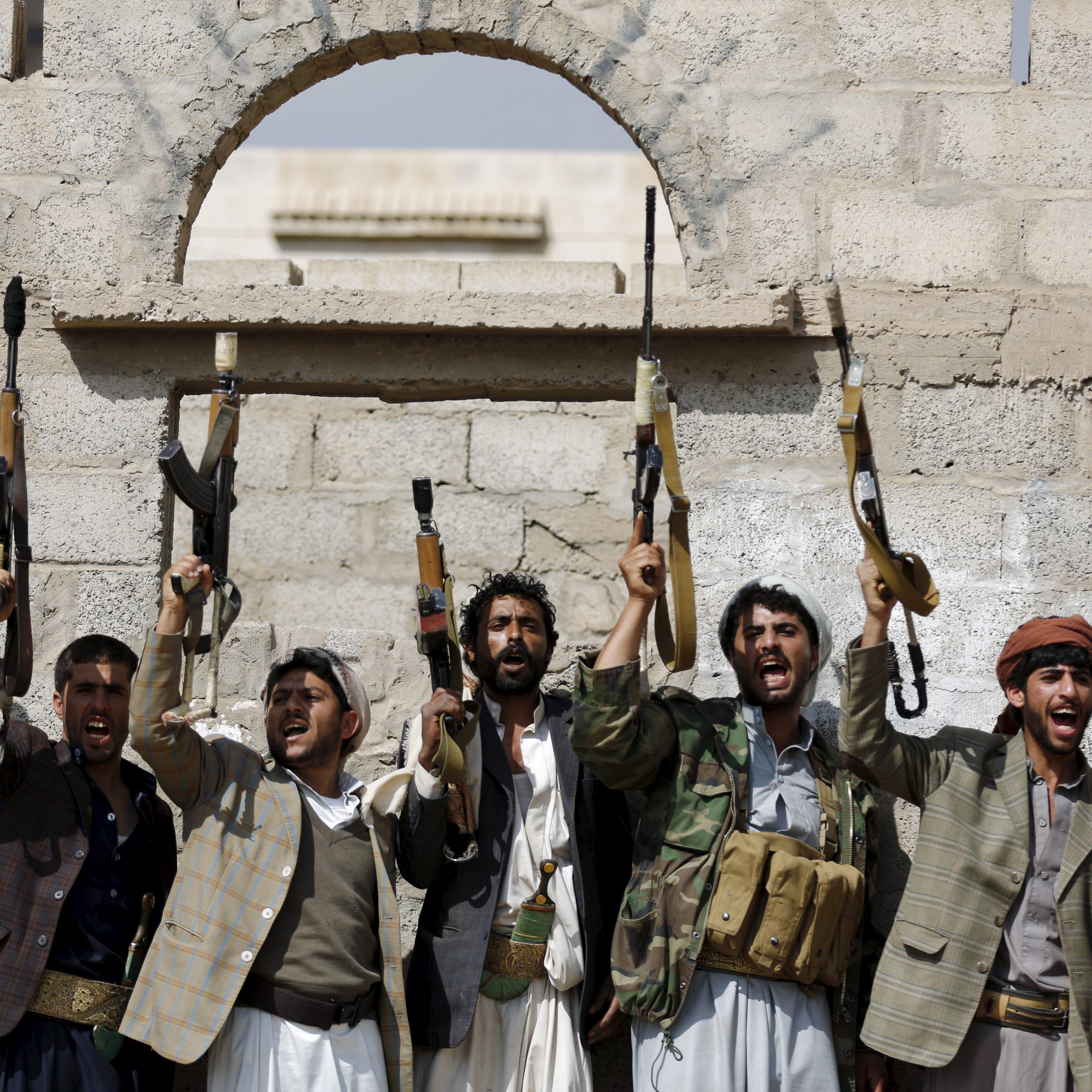 Tribesmen loyal to the Houthi movement shout slogans and raise their weapons during a gathering to show their support for the group, in Yemen's capital Sanaa