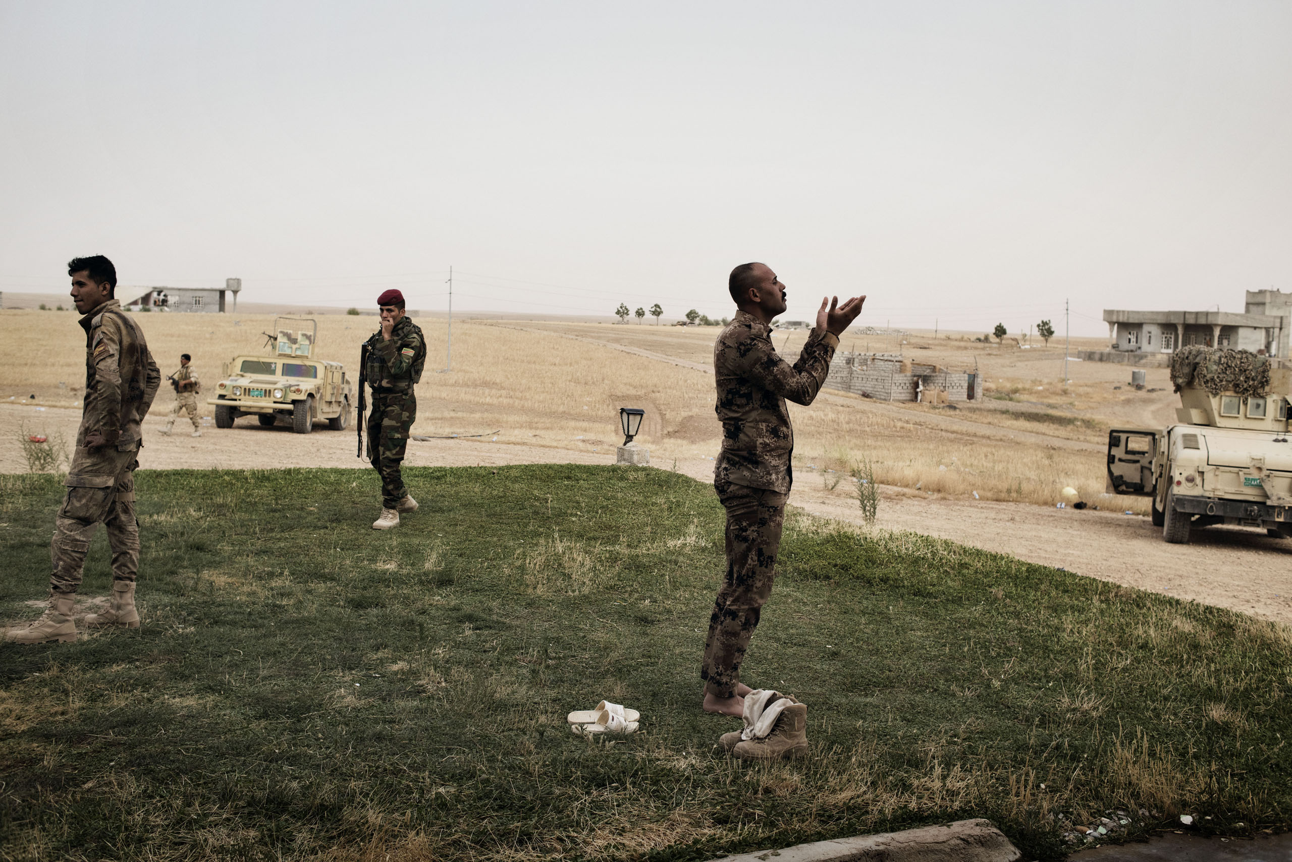 An Iraqi soldier prays south of Mosul, May 18, 2016. The Iraqi military is preparing for a major offensive to retake the city of Mosul from ISIS control.
