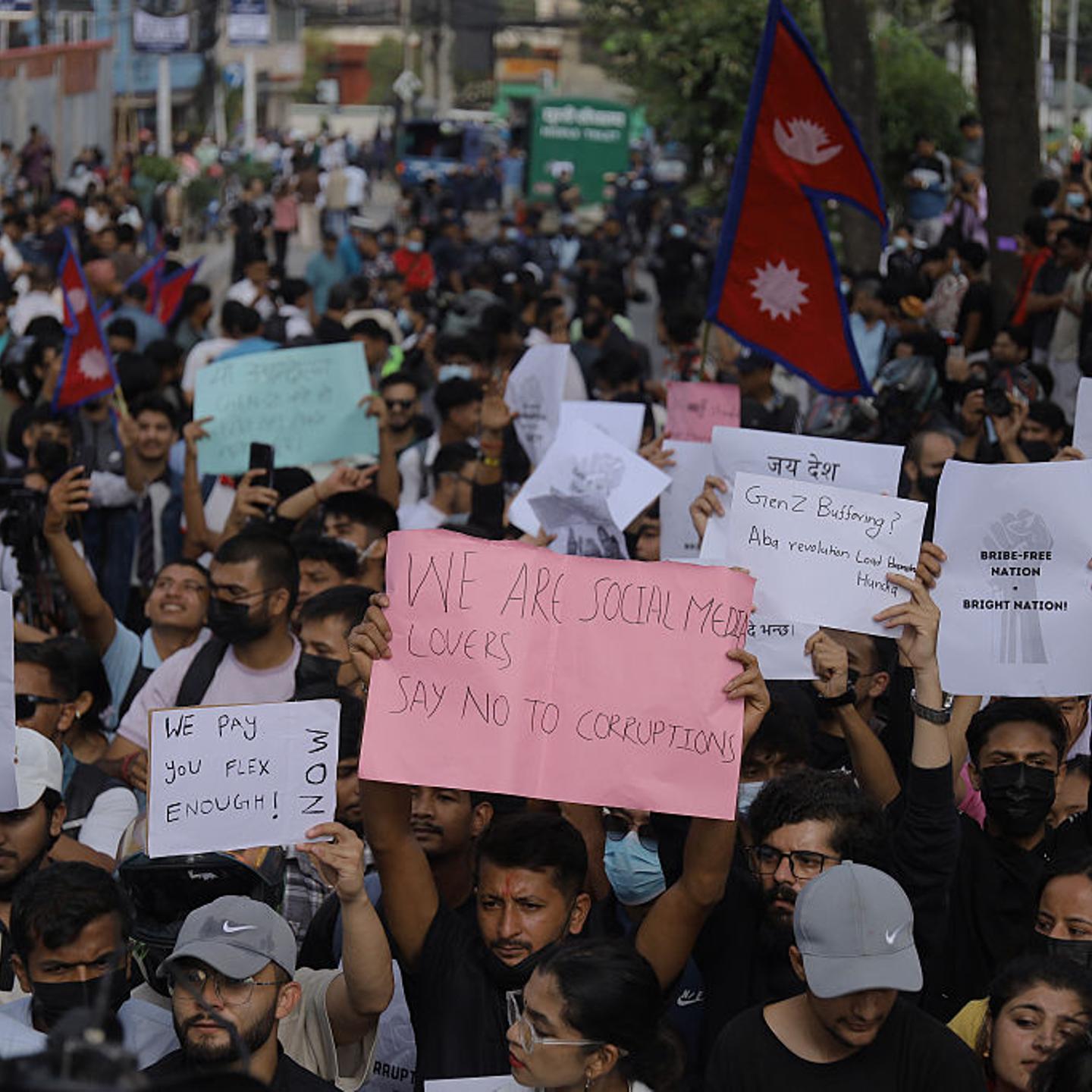 Protestors display placards in defiance during an anti-corruption and anti-social media ban protest in Kathmandu, Nepal, on Sept. 8, 2025.