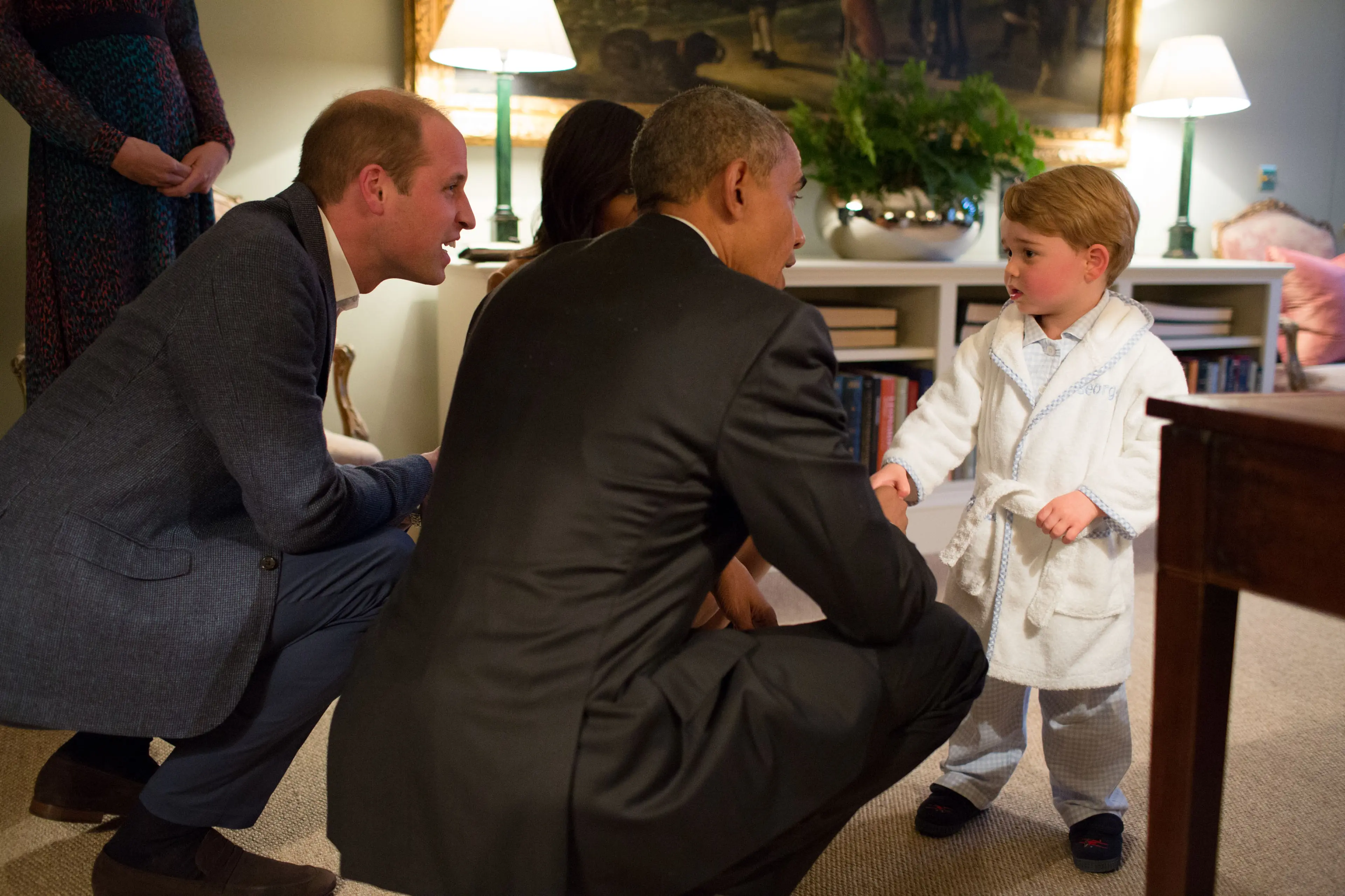 Prince George meets President Obama and First Lady Michelle Obama in April 2016. The robe that he wore later sold out.