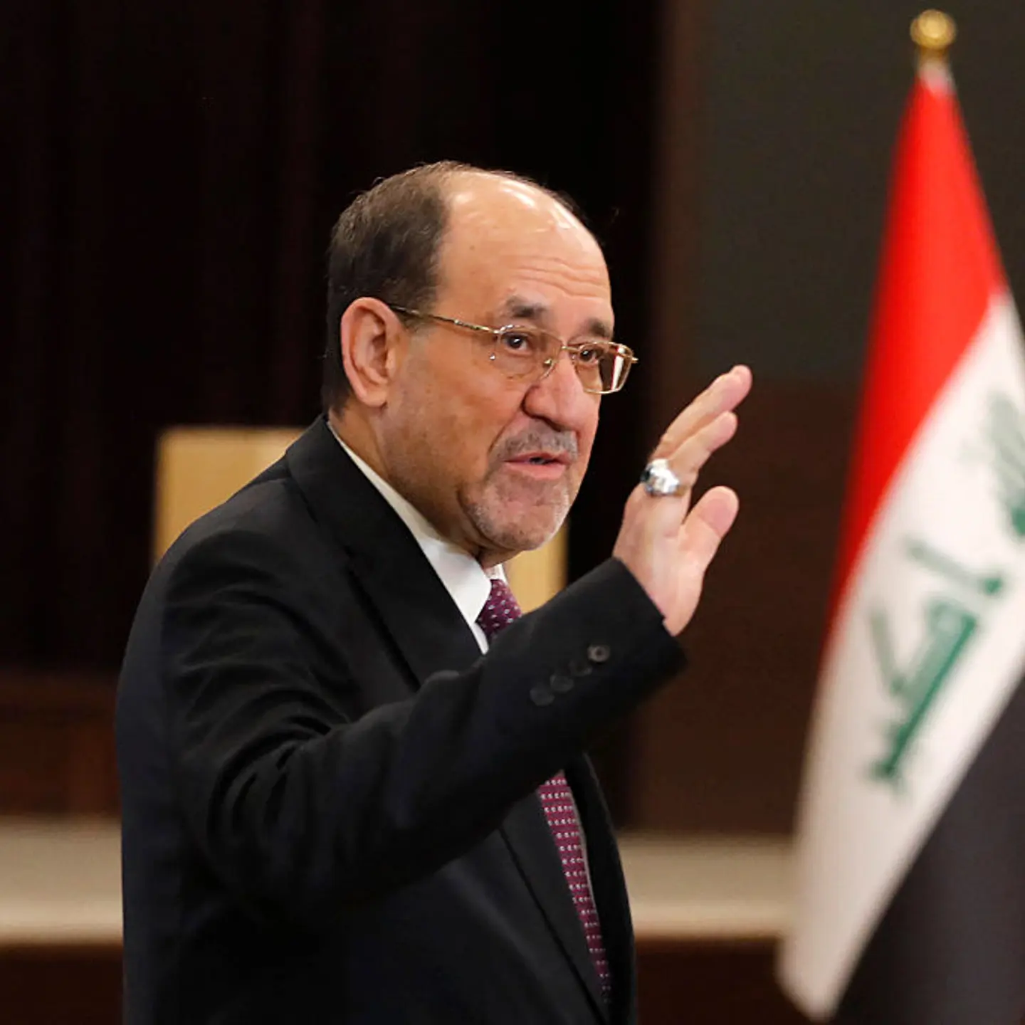Former Iraqi Prime Minister Nouri al-Maliki leaves after casting his ballot at a polling station in Baghdad during Iraq's parliamentary elections on Nov. 11, 2025.