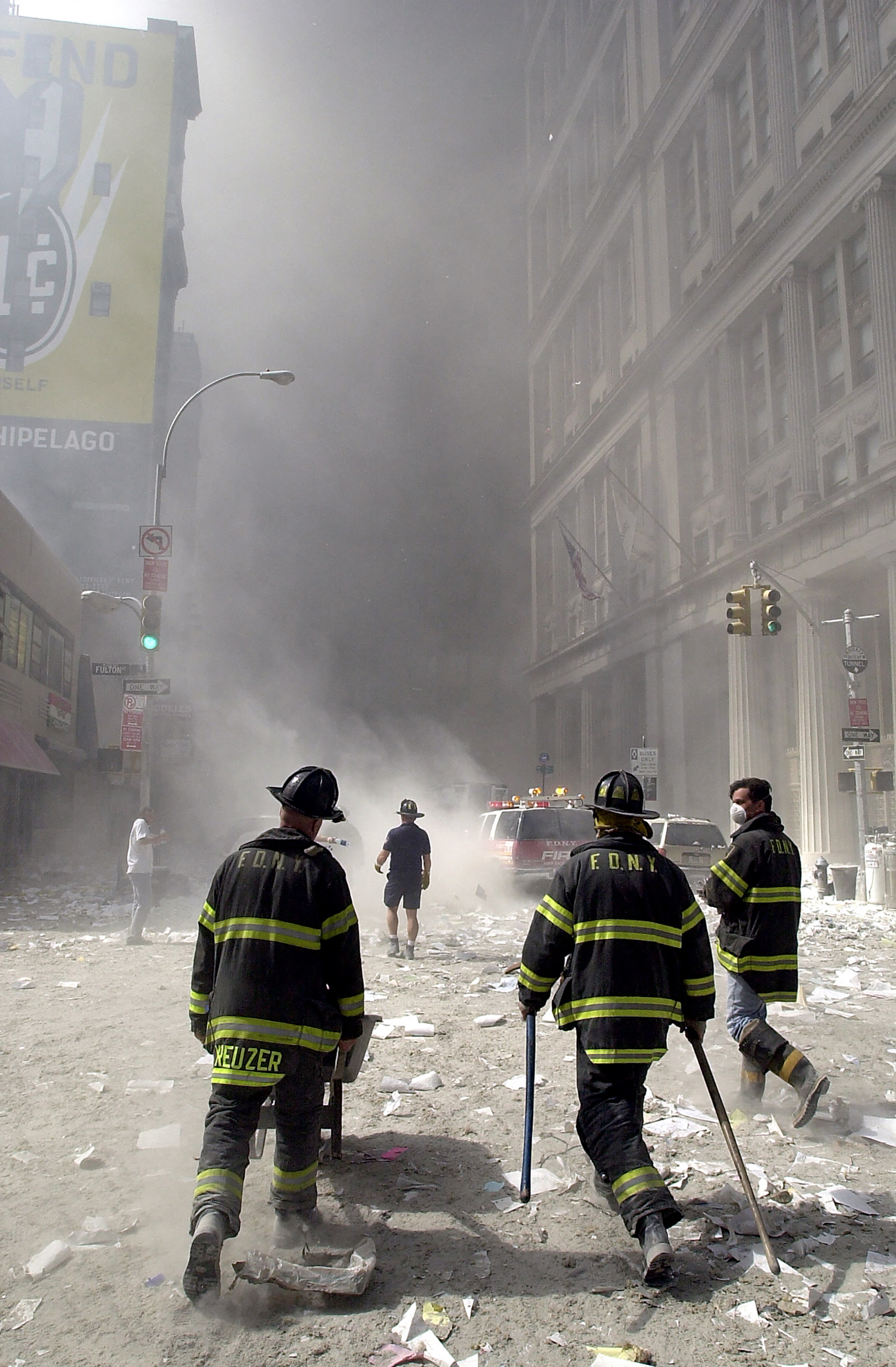 Firefighters approach the collapsed World Trade Center on Sept. 11, 2001