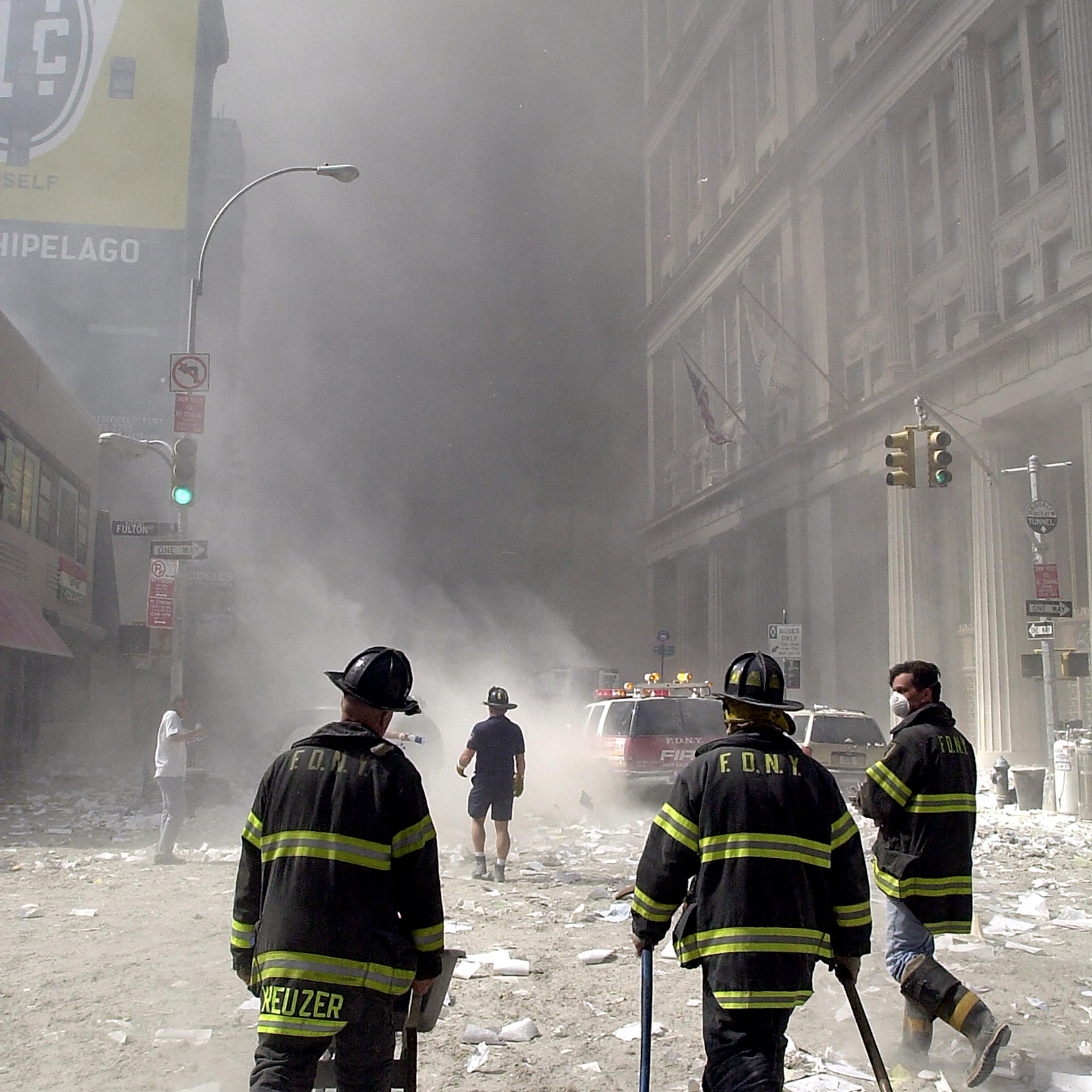 Firefighters approach the collapsed World Trade Center on Sept. 11, 2001