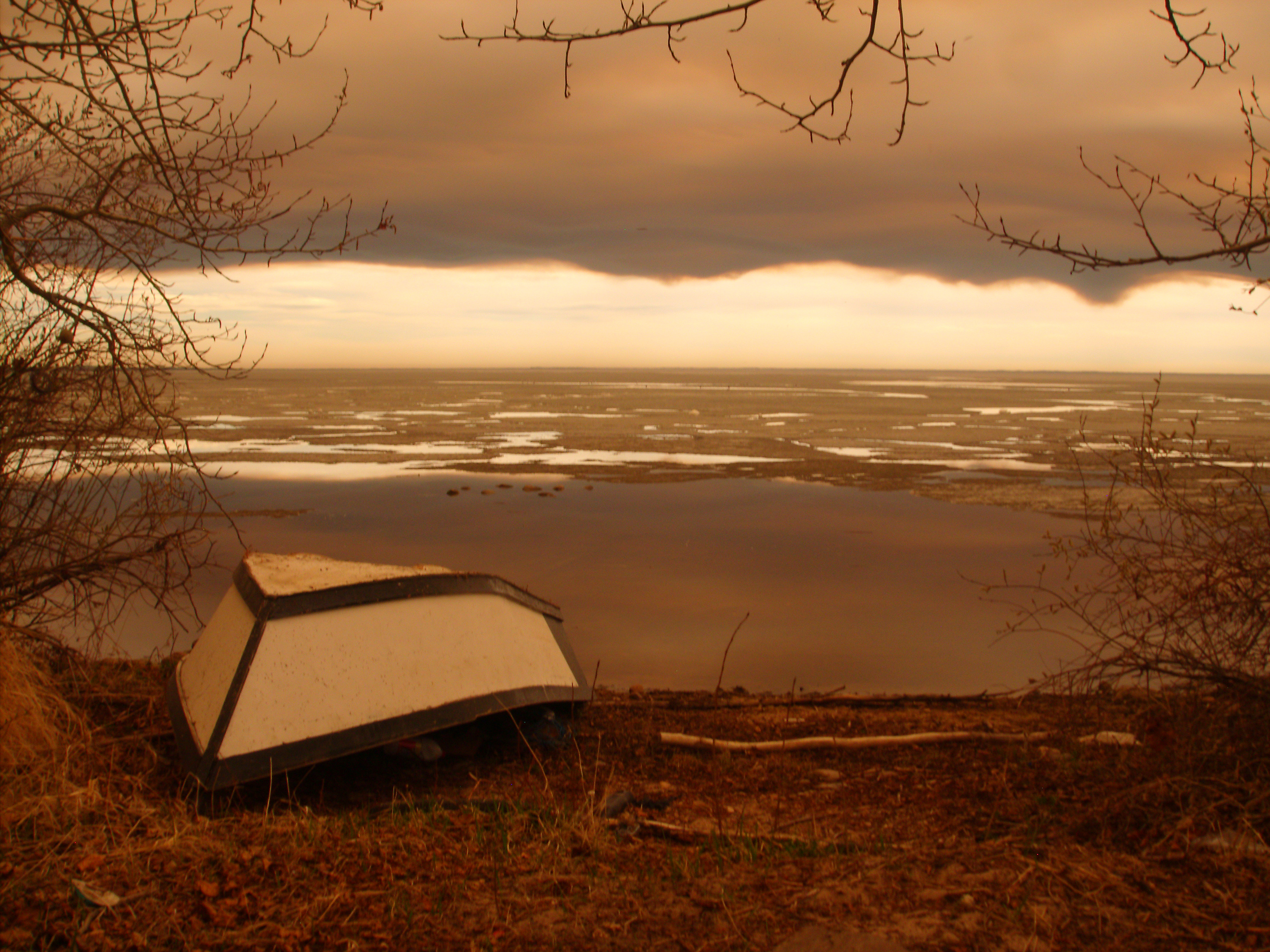Smoke from Fort McMurray-area wildfires that forced evacuations hangs over the still-frozen Lac La Loche across the provincial border in La Loche
