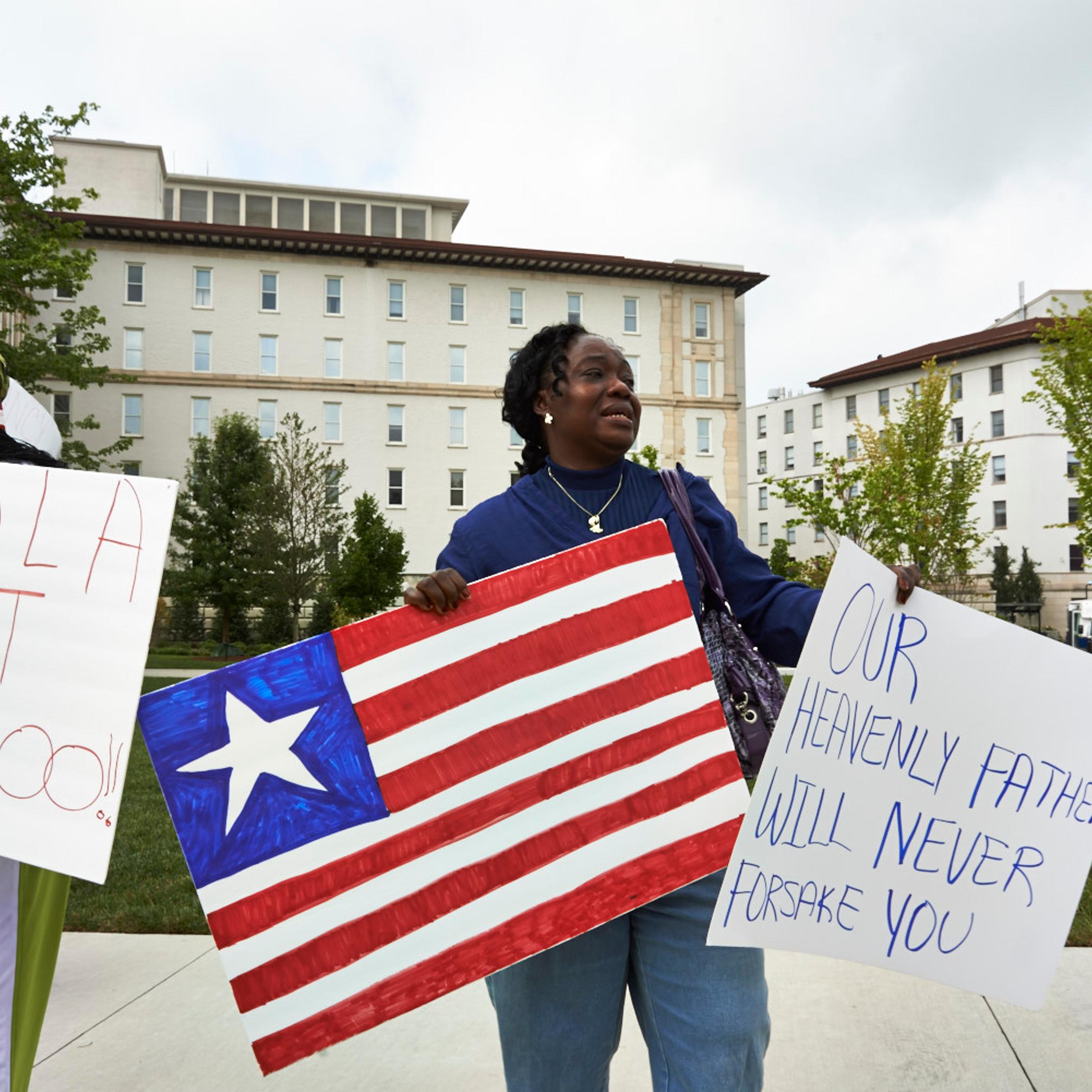Garmai Kpardeh, a member of the Liberian Association of Metropolitan Atlanta rallying in front of Emory University Hospital, August 9.