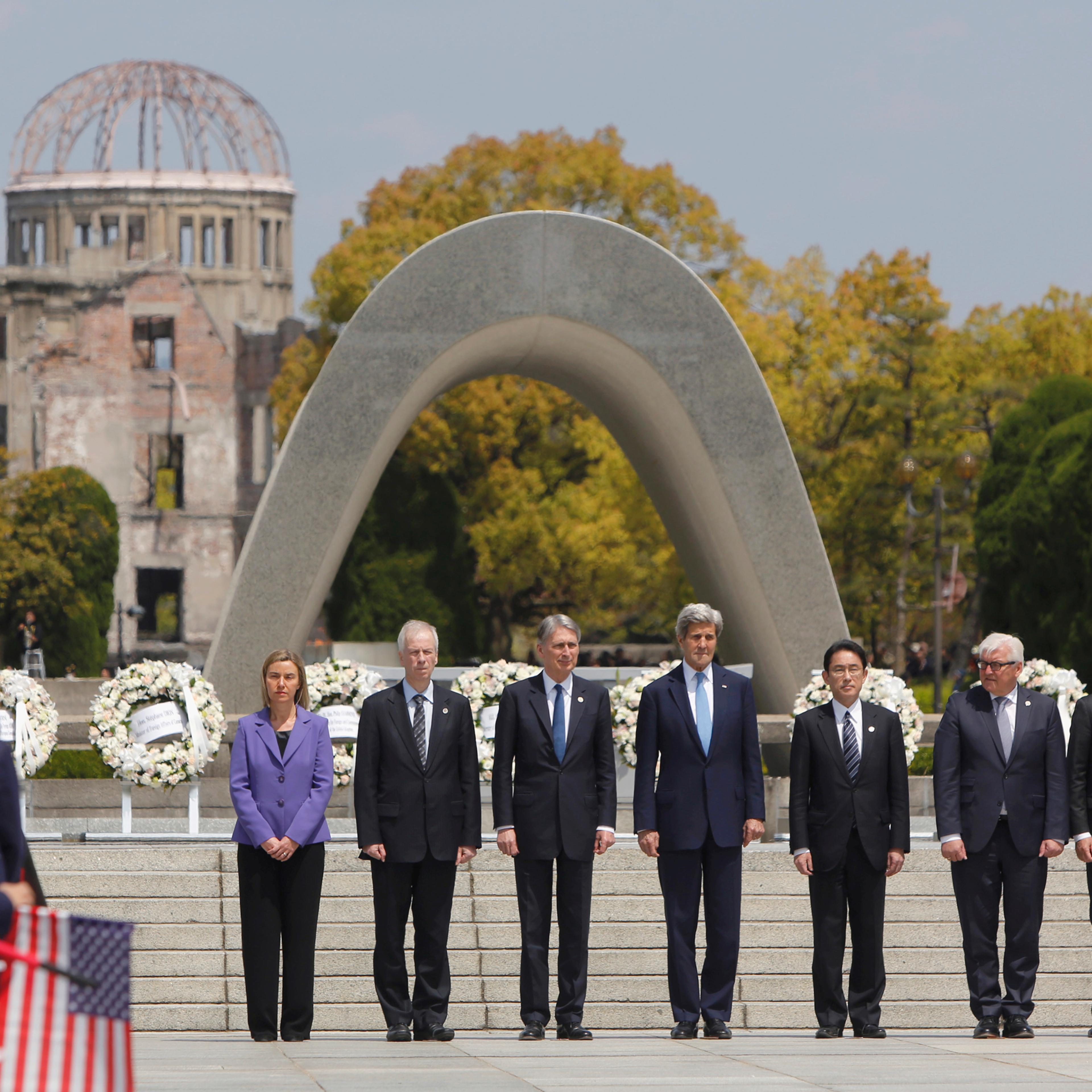 G7 foreign ministers stand together after placing wreaths at the cenotaph at Hiroshima Peace Memorial Park in Hiroshima, western Japan on April 11, 2016. Pictured from left are E.U. High Representative for Foreign Affairs Federica Mogherini, Canada's For