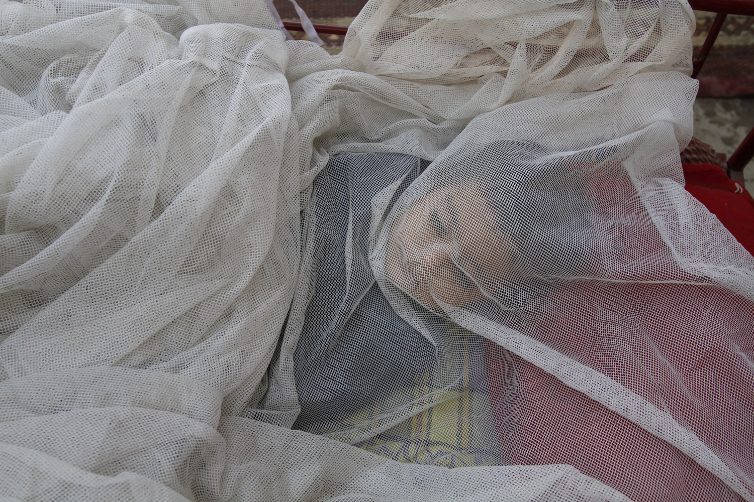 June 23, 2012. Rehana, 11 months, sleeps beneath a mosquito net on the outskirts of Jalalabad, east of Kabul, Afghanistan.