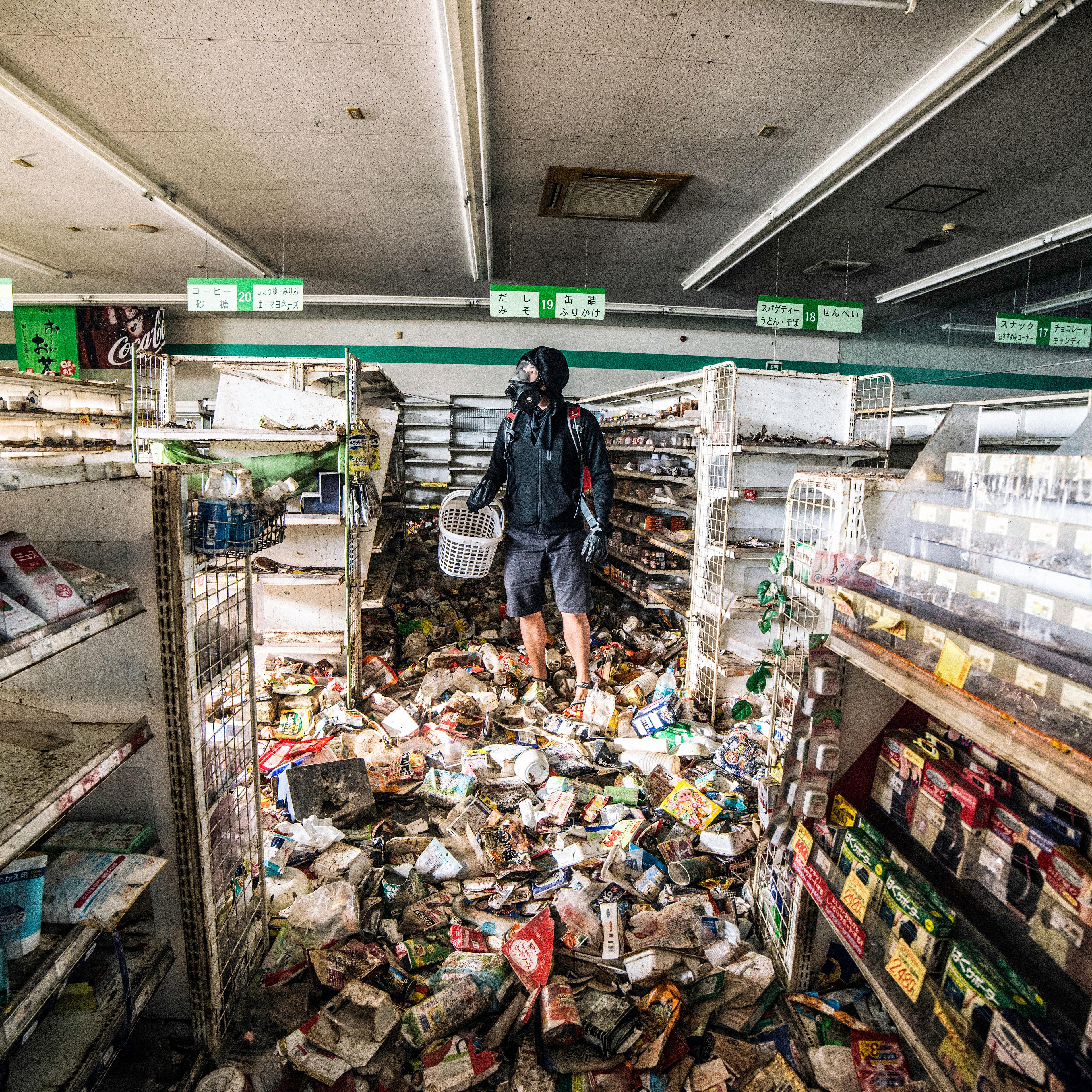 Malaysian photographer Keow Wee Loong ventured — ghostlike, if you will — into the Fukushima Exclusion Zone, within the twelve-mile radius around the old power plant, in June. The photographer "shops" in the super market York Benimaru on June 4, 2016.
