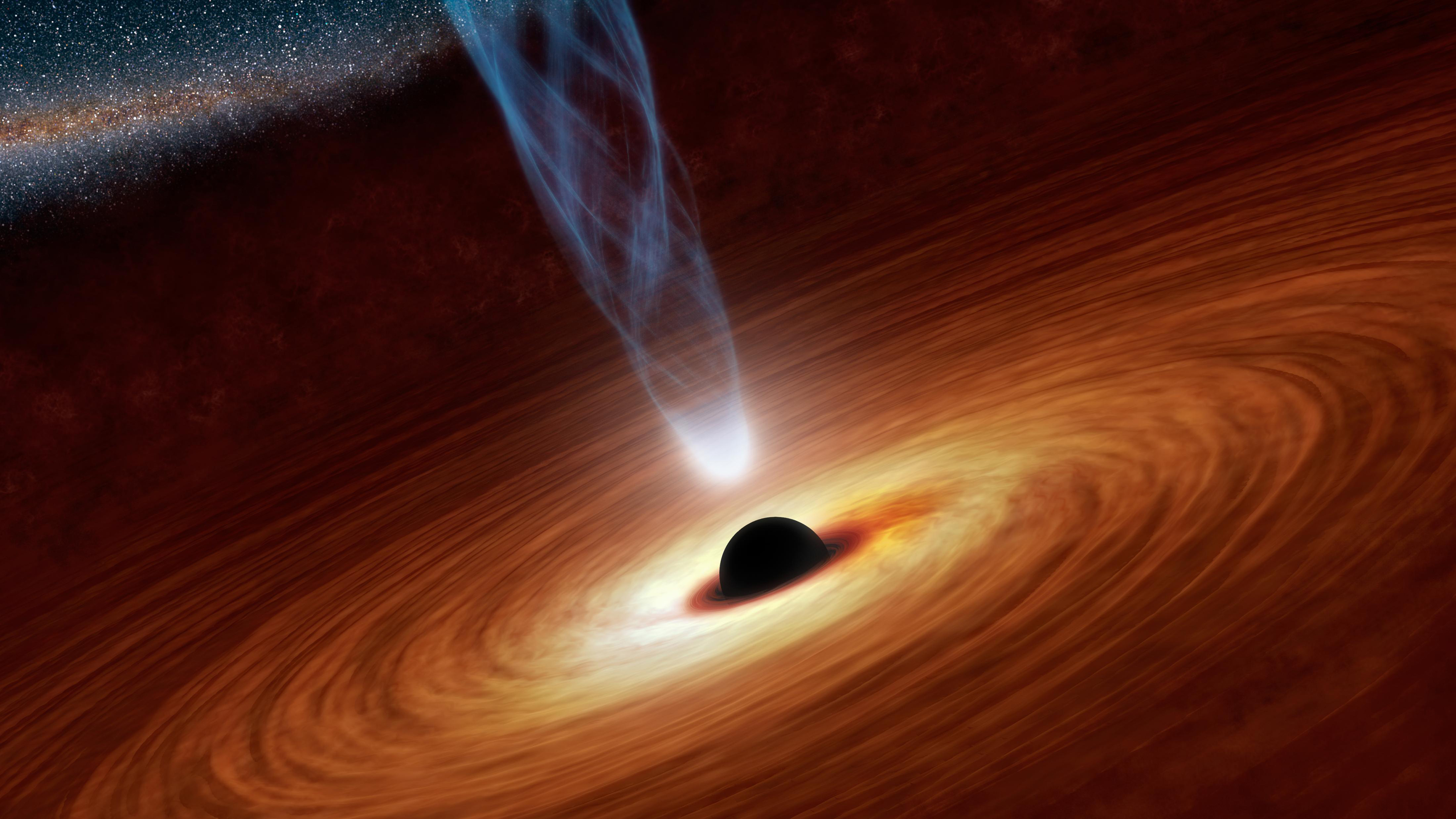 An artist's illustration shows a supermassive black hole with millions to billions times the mass of our sun at the center released by NASA on February 27, 2013.