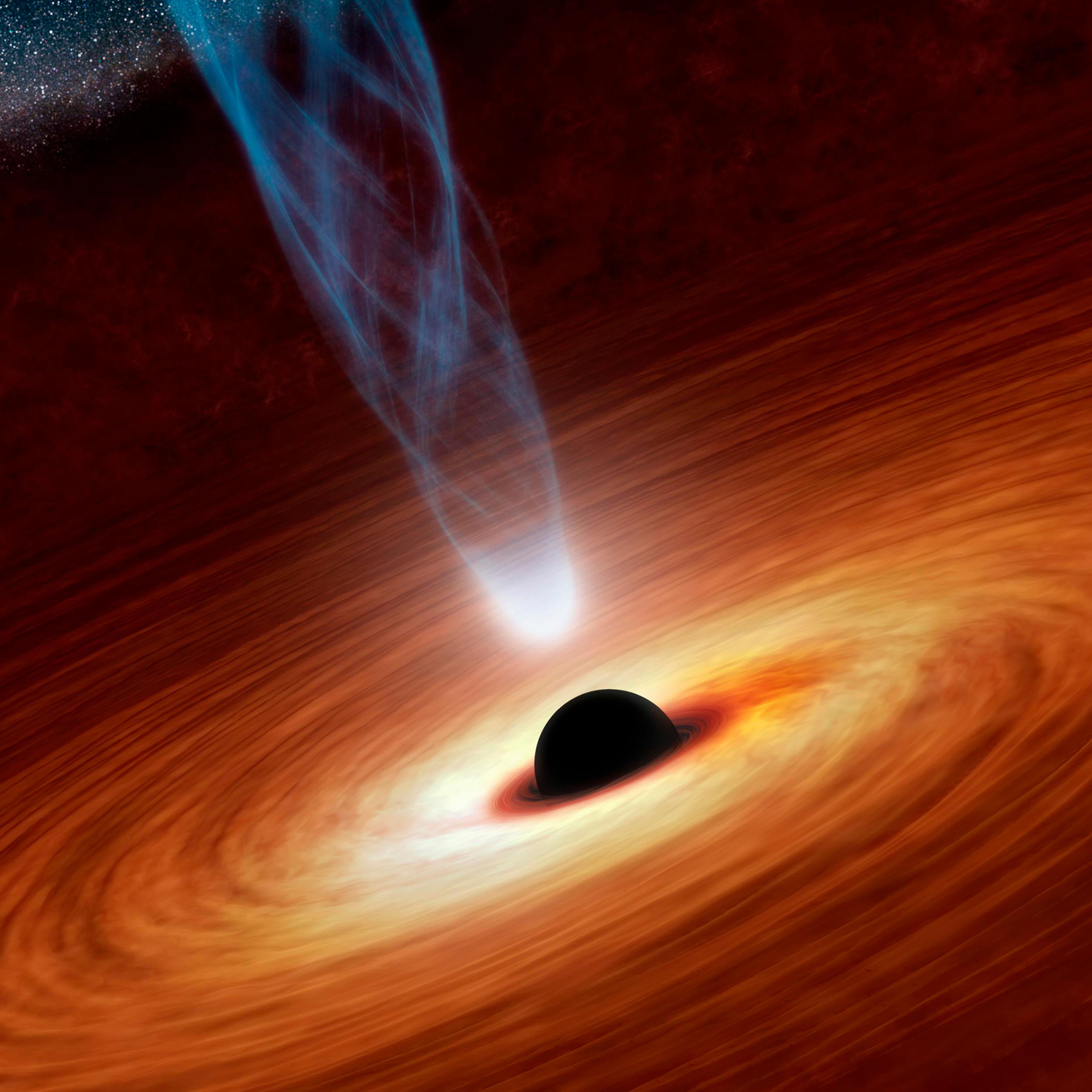 An artist's illustration shows a supermassive black hole with millions to billions times the mass of our sun at the center released by NASA on February 27, 2013.