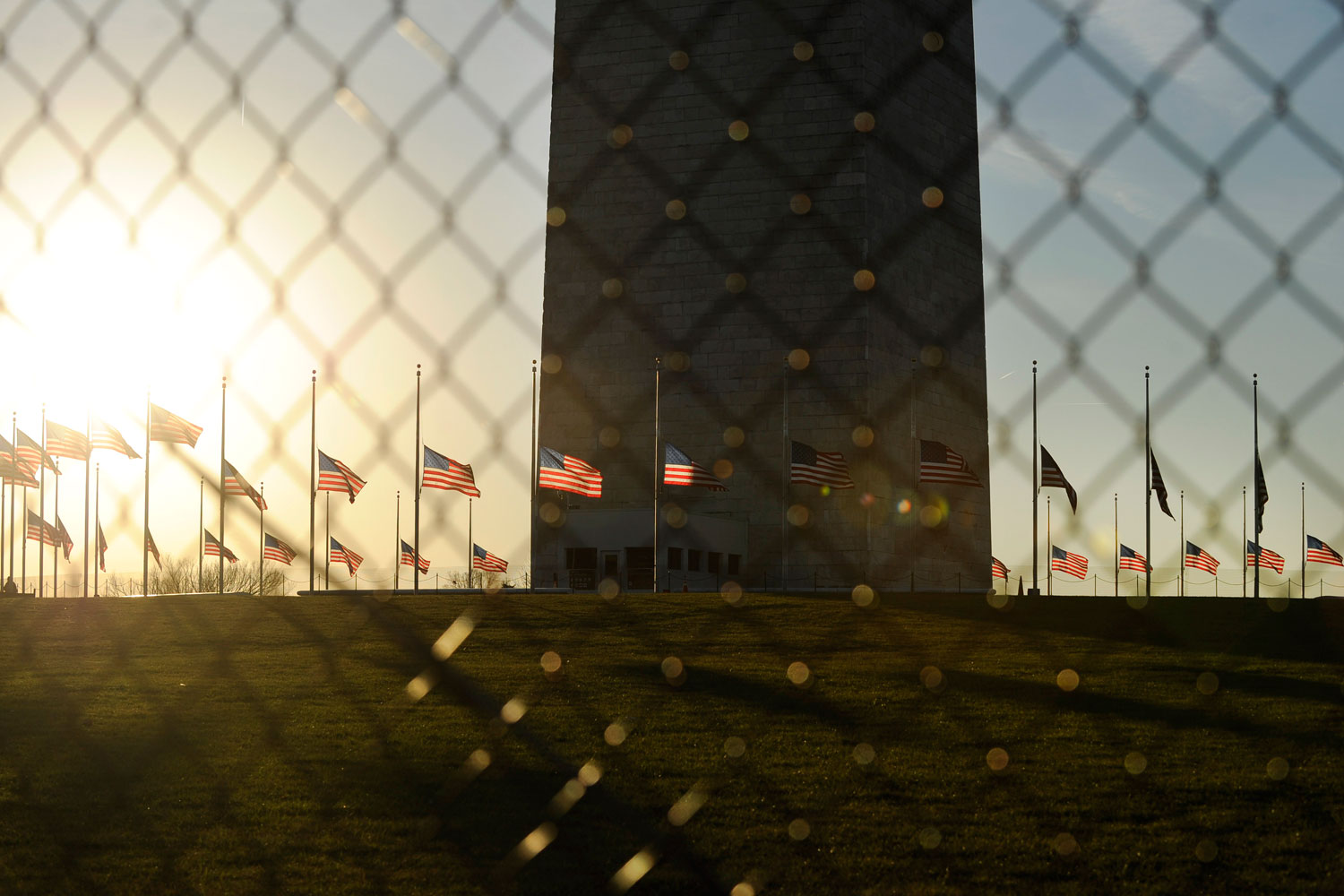 Dec. 14, 2012. U.S. flags fly at half staff at the base of the Washington Monument in Washington D.C. to honor the victims of the Connecticut shooting incident.