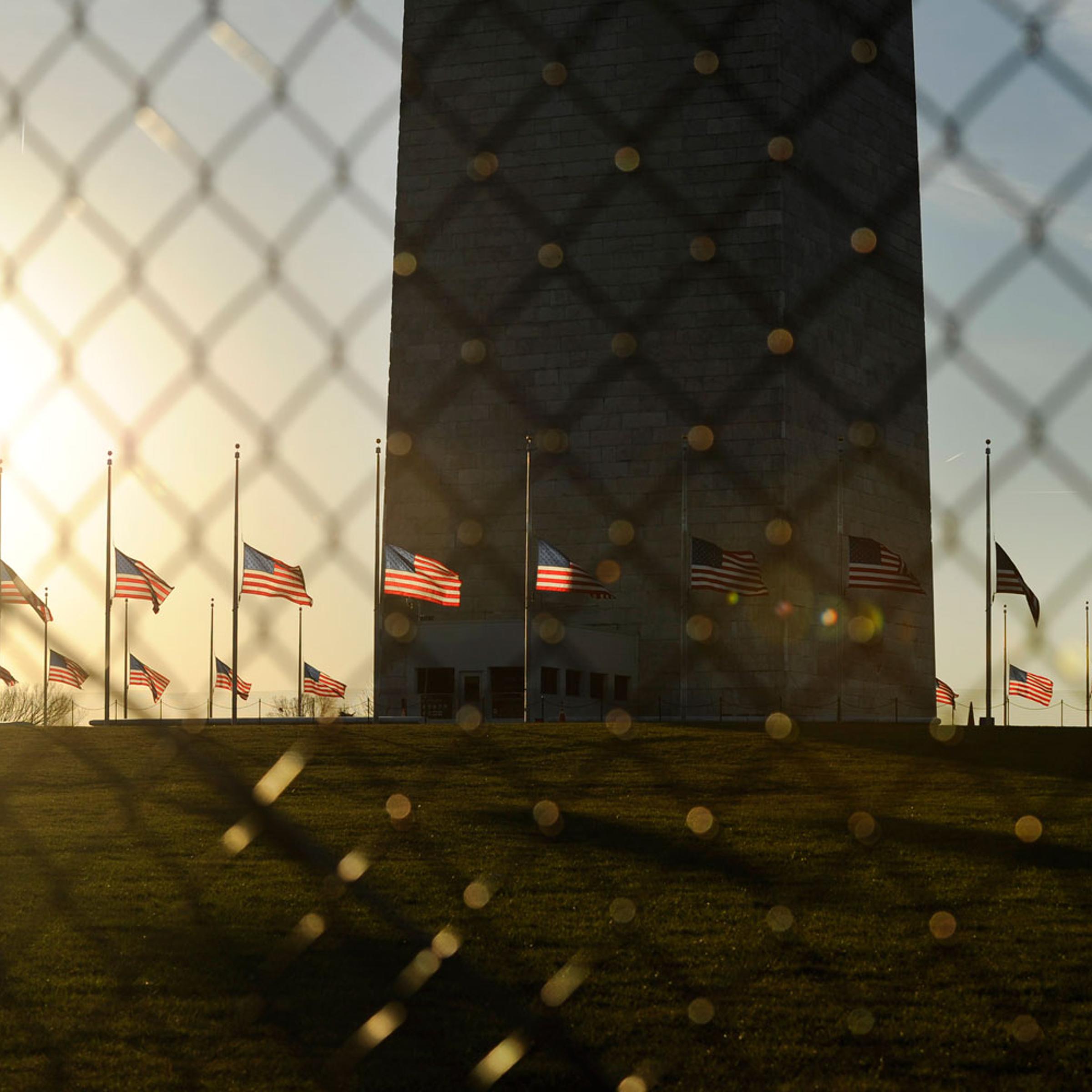 Dec. 14, 2012. U.S. flags fly at half staff at the base of the Washington Monument in Washington D.C. to honor the victims of the Connecticut shooting incident.