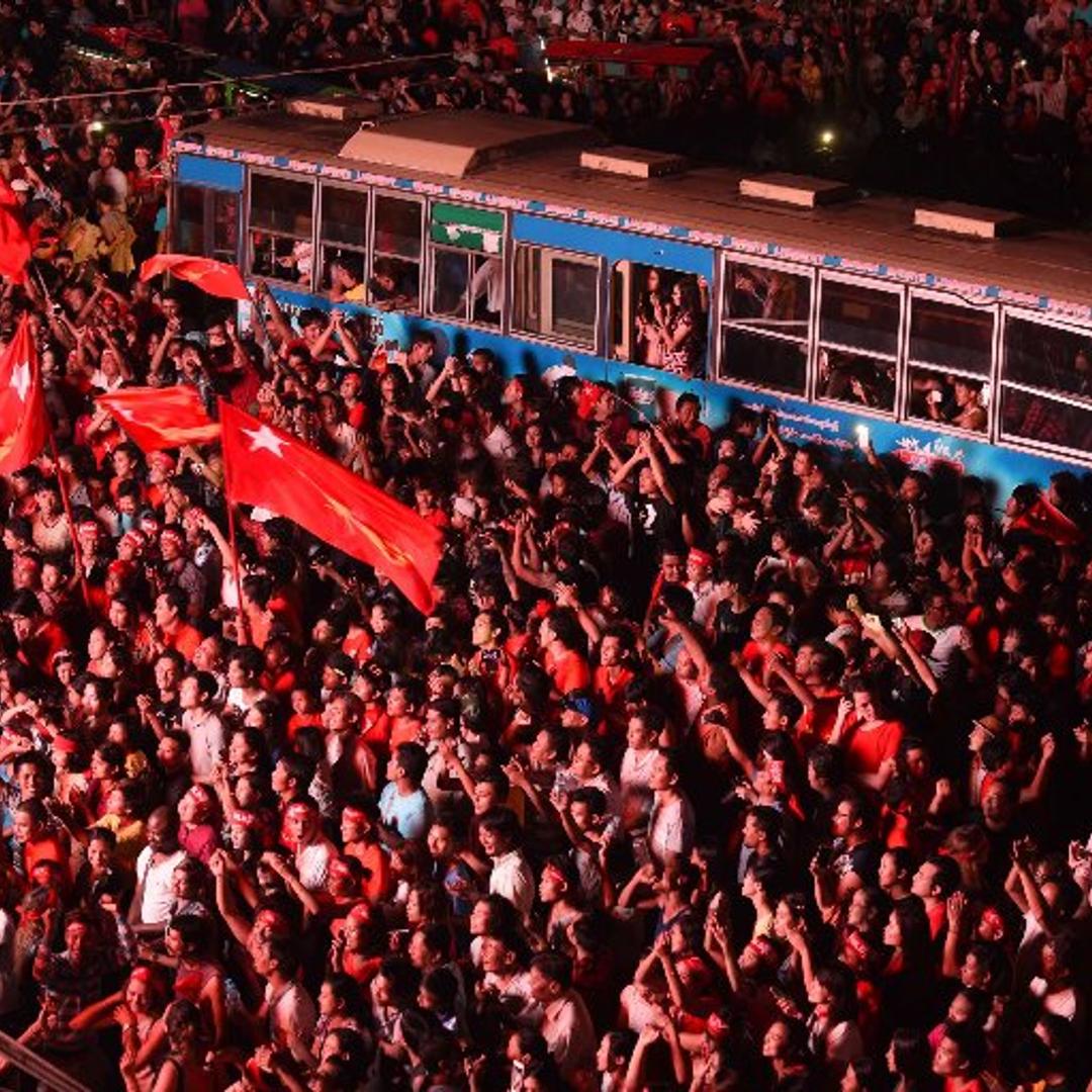Supporters of Aung San Suu Kyi's National League for Democracy party cheer as they watch results from Myanmar's election, Nov. 9, 2015.