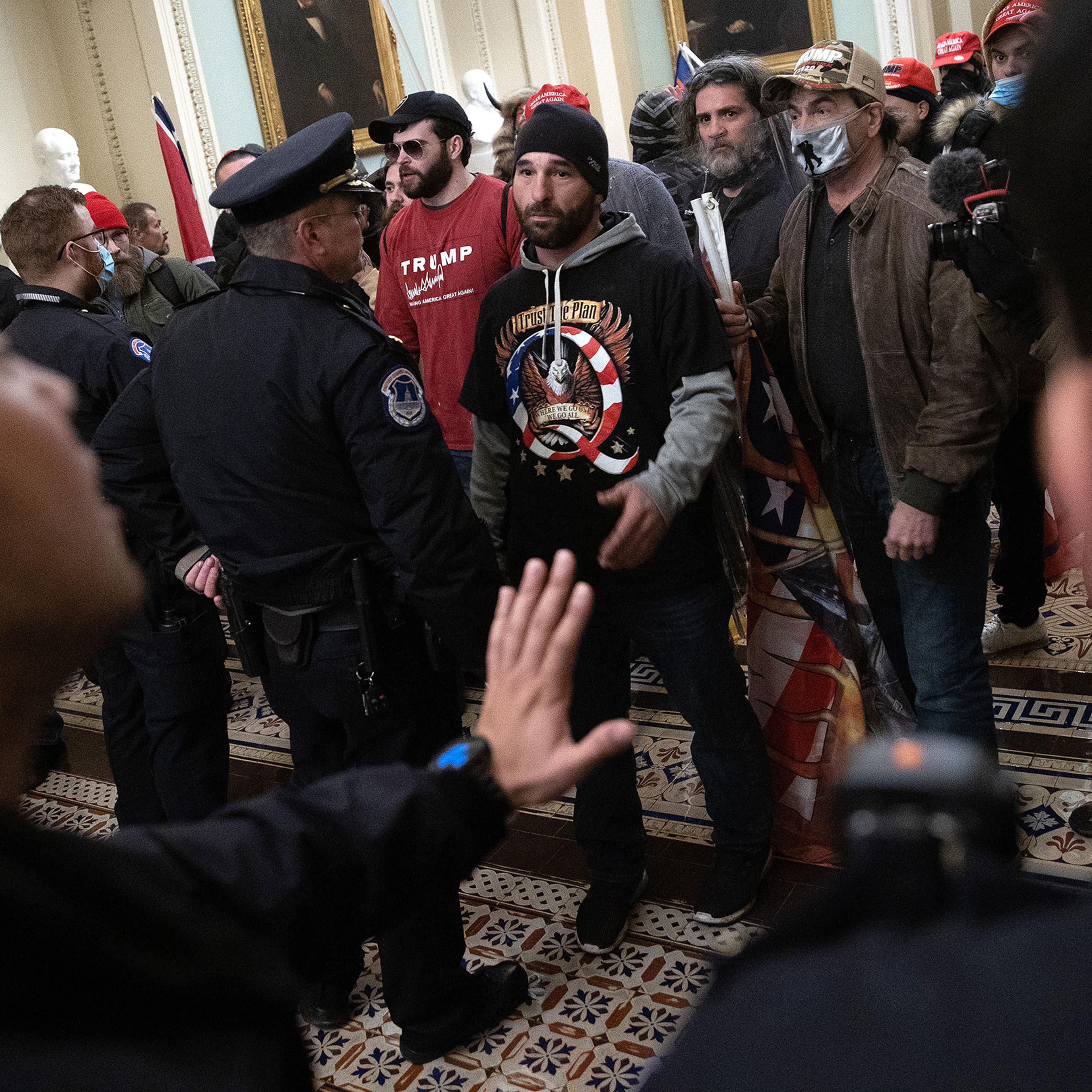 A pro-Trump mob confronts U.S. Capitol police after the group stormed the building on Jan. 06, 2021.