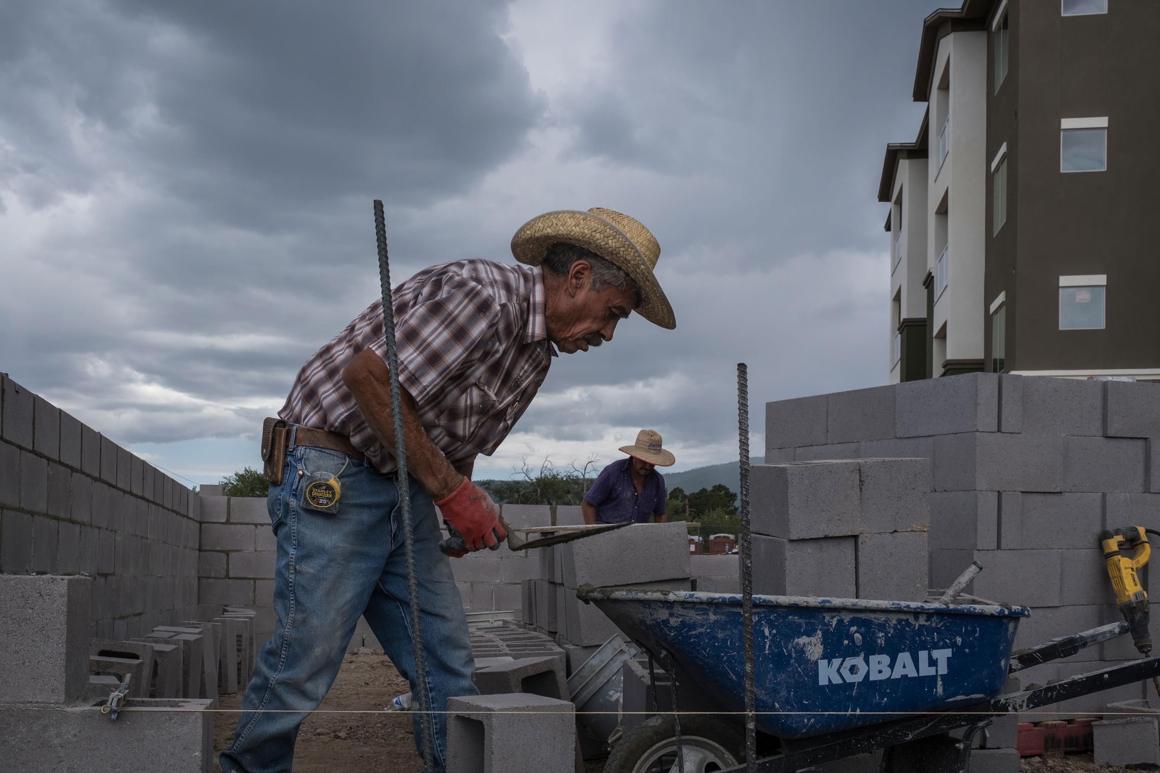 workers at a housing construction site in Los Alamos
