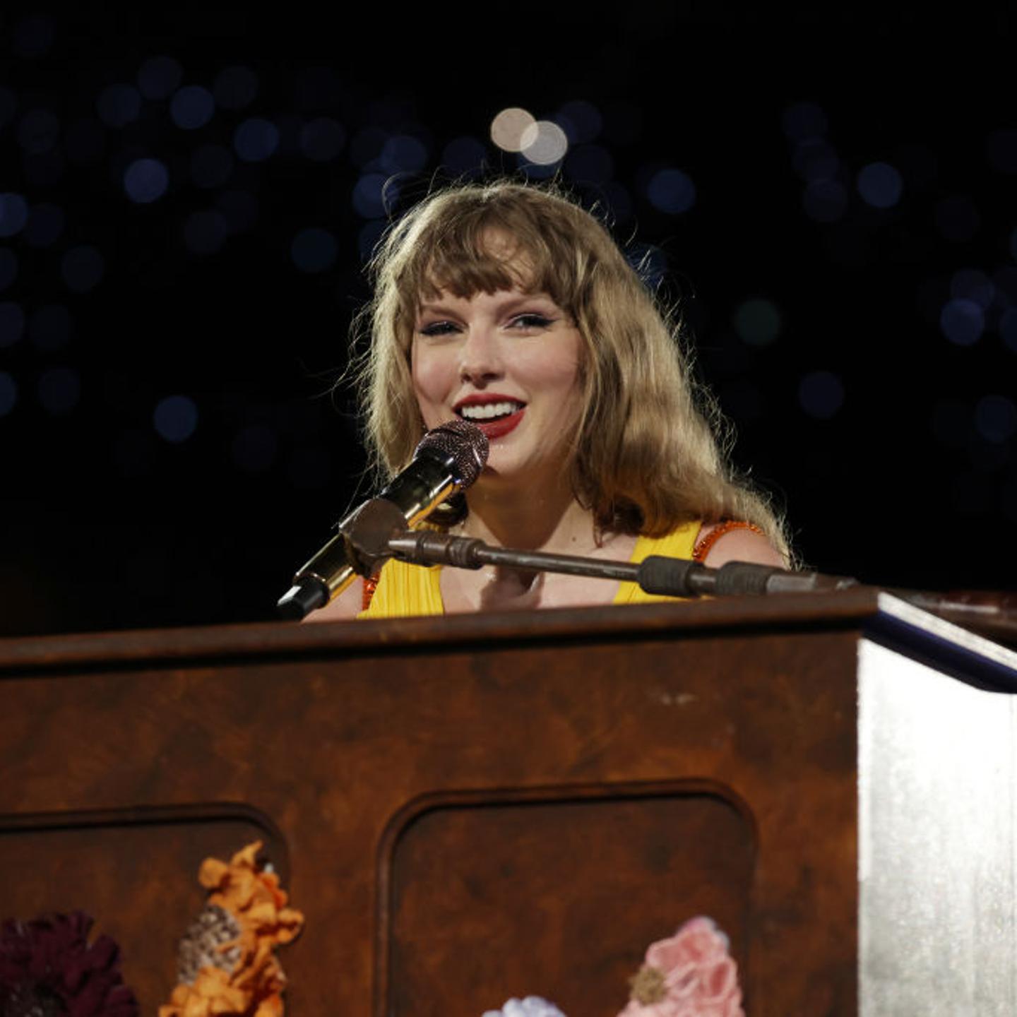 Taylor Swift at a piano