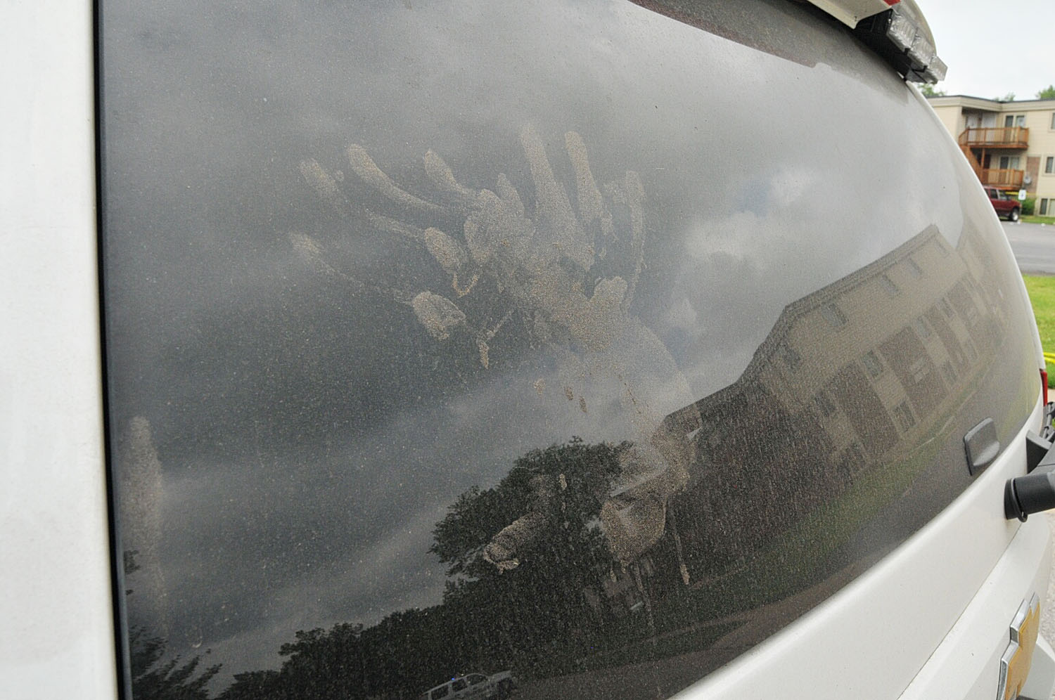 An undated evidence photograph made available by the St. Louis County prosecutors office on Nov. 25, 2014 shows handprints on the rear window of Ferguson Police officer Darren Wilson's vehicle.
