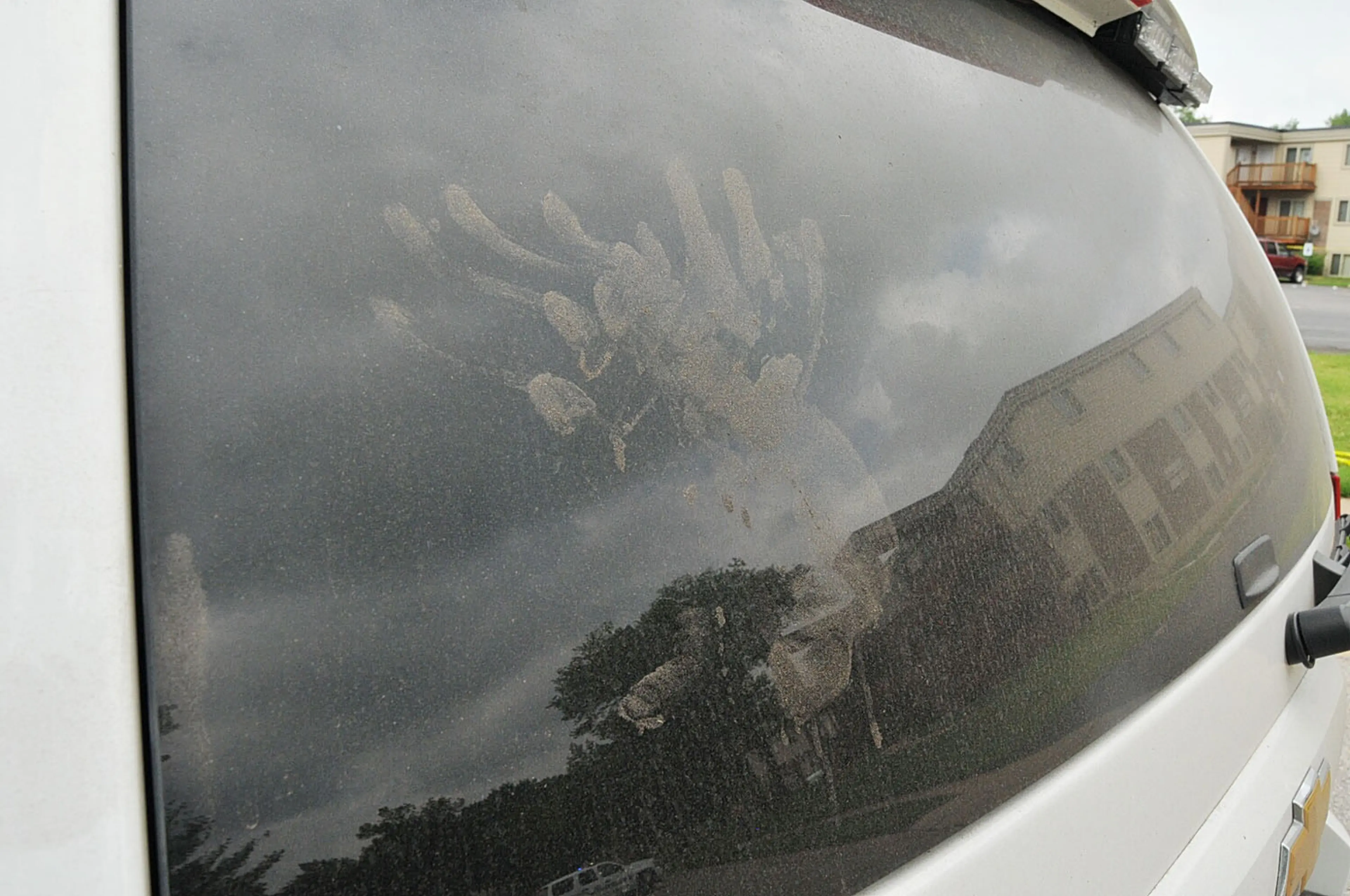 An undated evidence photograph made available by the St. Louis County prosecutors office on Nov. 25, 2014 shows handprints on the rear window of Ferguson Police officer Darren Wilson's vehicle.