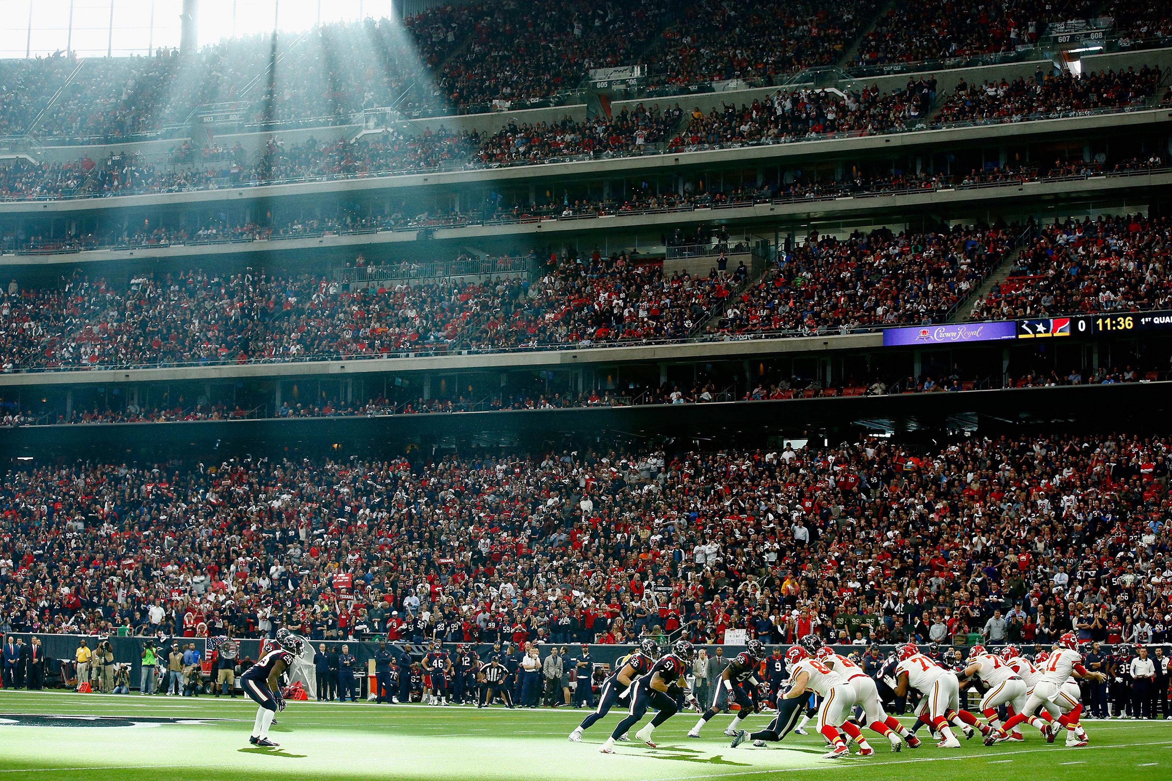 Quarterback Alex Smith #11 of the Kansas City Chiefs drops back to pass against the Houston Texans during the first quarter of the AFC Wild Card Playoff game at NRG Stadium in Houston, Texas, on Jan. 9, 2016.